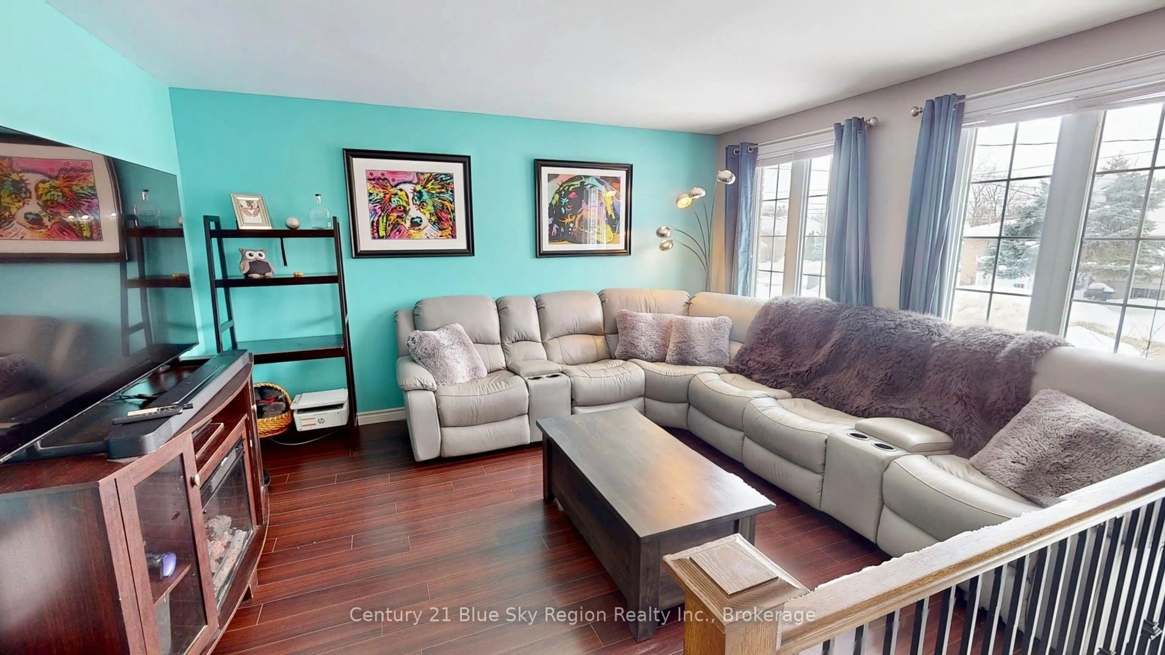 Living room with furniture, wood/laminate floor for 1244 Burns St, North Bay Ontario P1B 8Y9