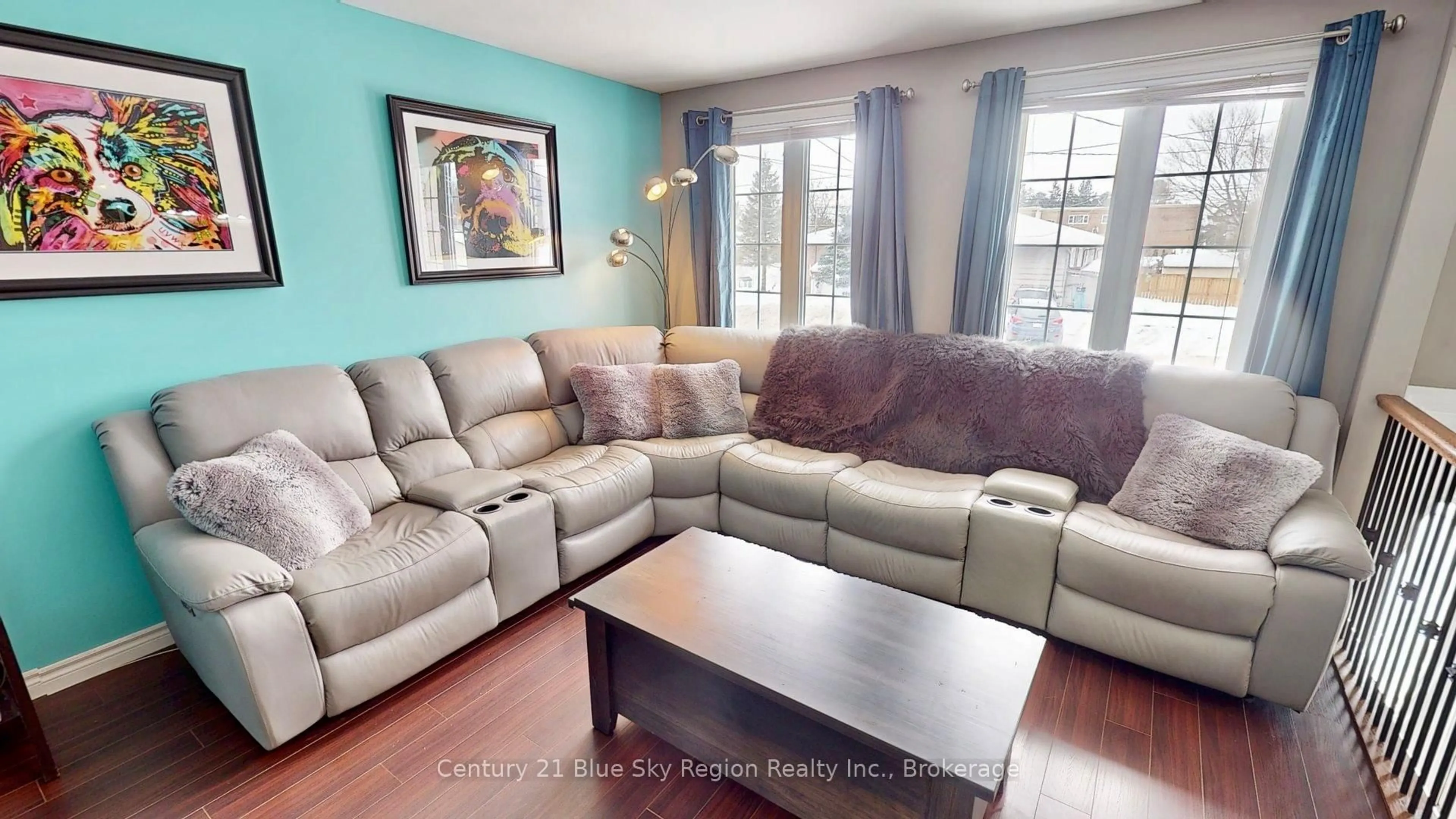 Living room with furniture, wood/laminate floor for 1244 Burns St, North Bay Ontario P1B 8Y9