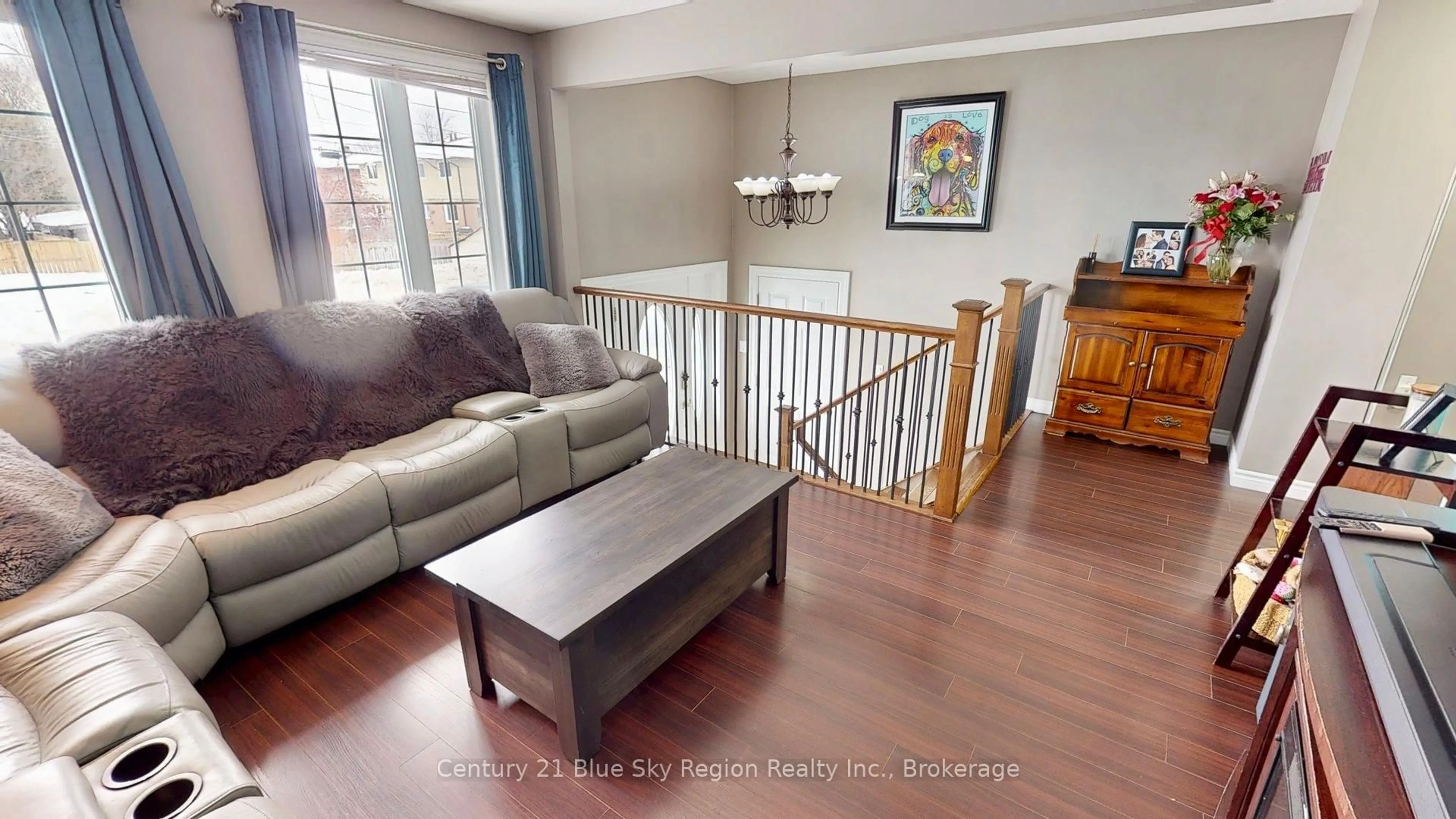 Living room with furniture, wood/laminate floor for 1244 Burns St, North Bay Ontario P1B 8Y9
