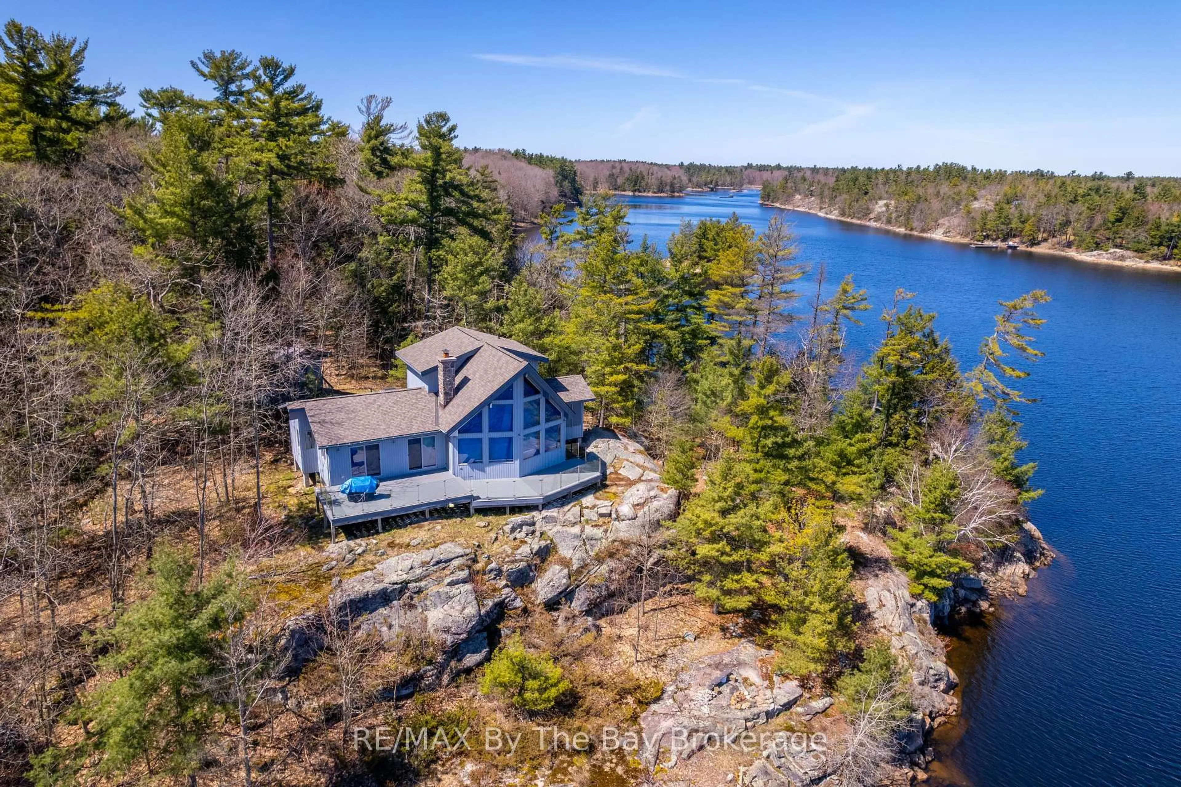 A pic from outside/outdoor area/front of a property/back of a property/a pic from drone, water/lake/river/ocean view for 23212 Georgian Bay Shore, Georgian Bay Ontario P0E 1E0
