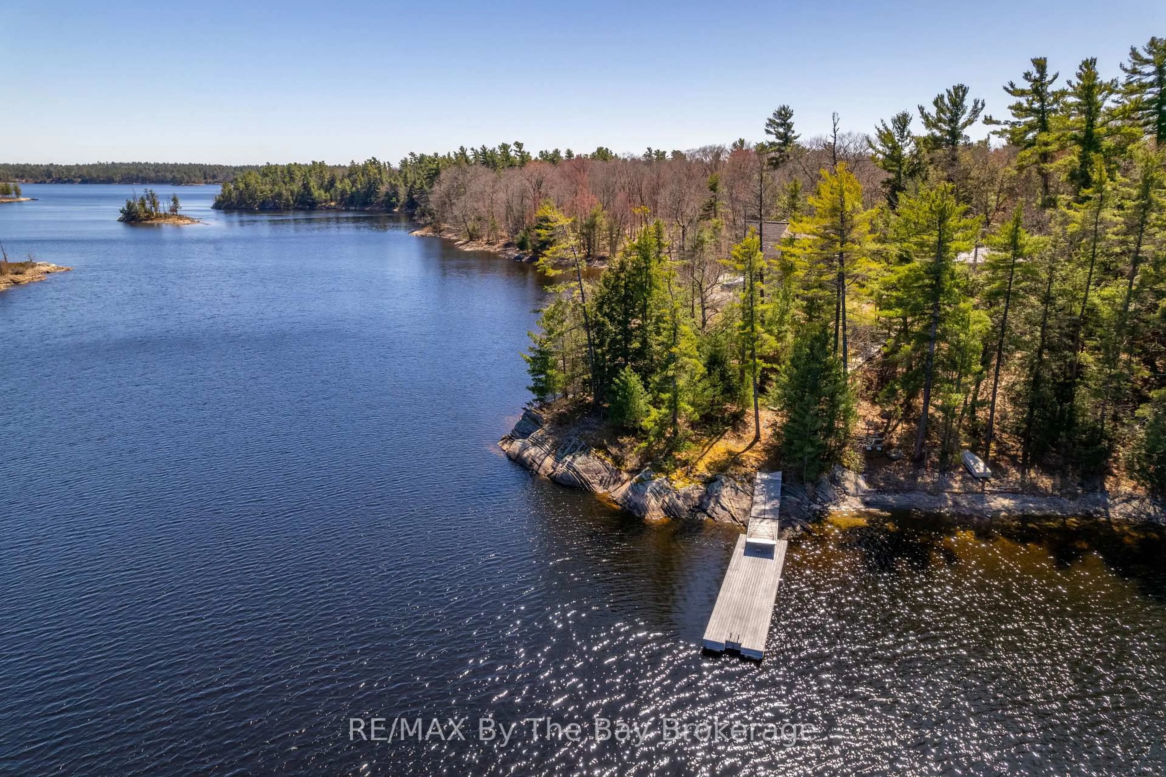 A pic from outside/outdoor area/front of a property/back of a property/a pic from drone, water/lake/river/ocean view for 23212 Georgian Bay Shore, Georgian Bay Ontario P0E 1E0