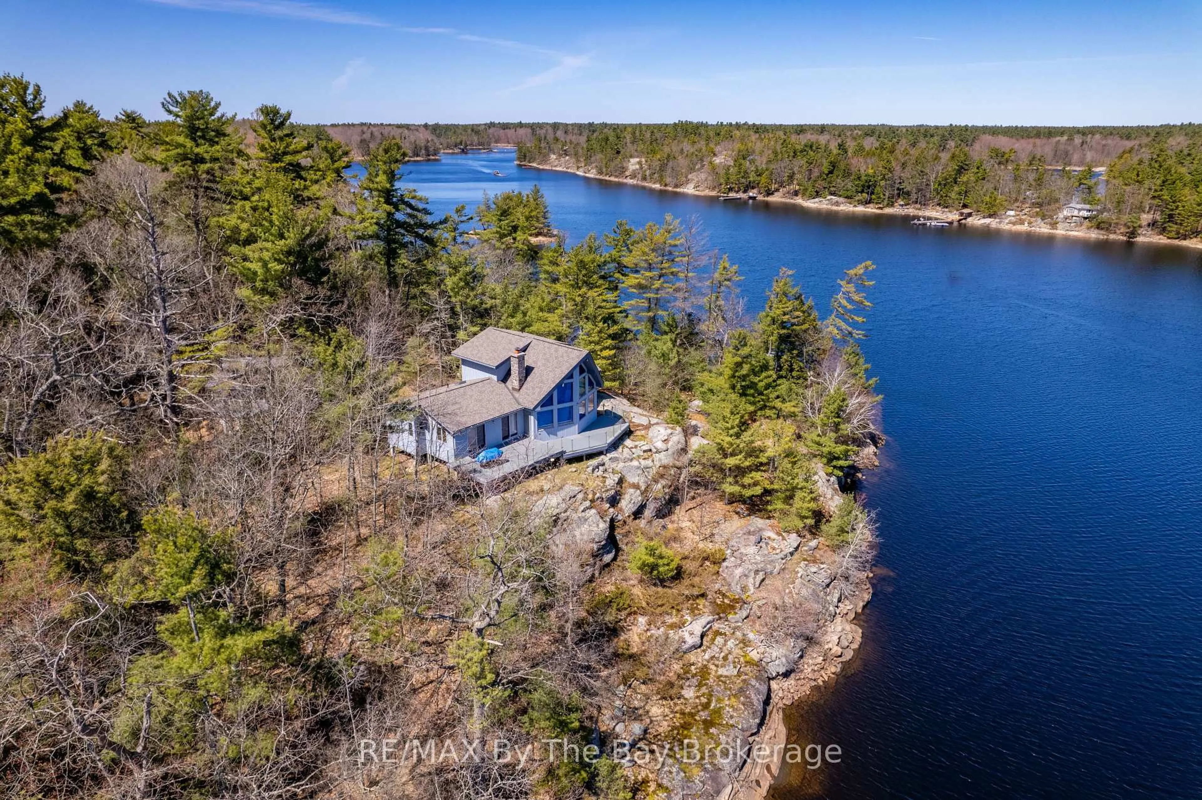 A pic from outside/outdoor area/front of a property/back of a property/a pic from drone, water/lake/river/ocean view for 23212 Georgian Bay Shore, Georgian Bay Ontario P0E 1E0