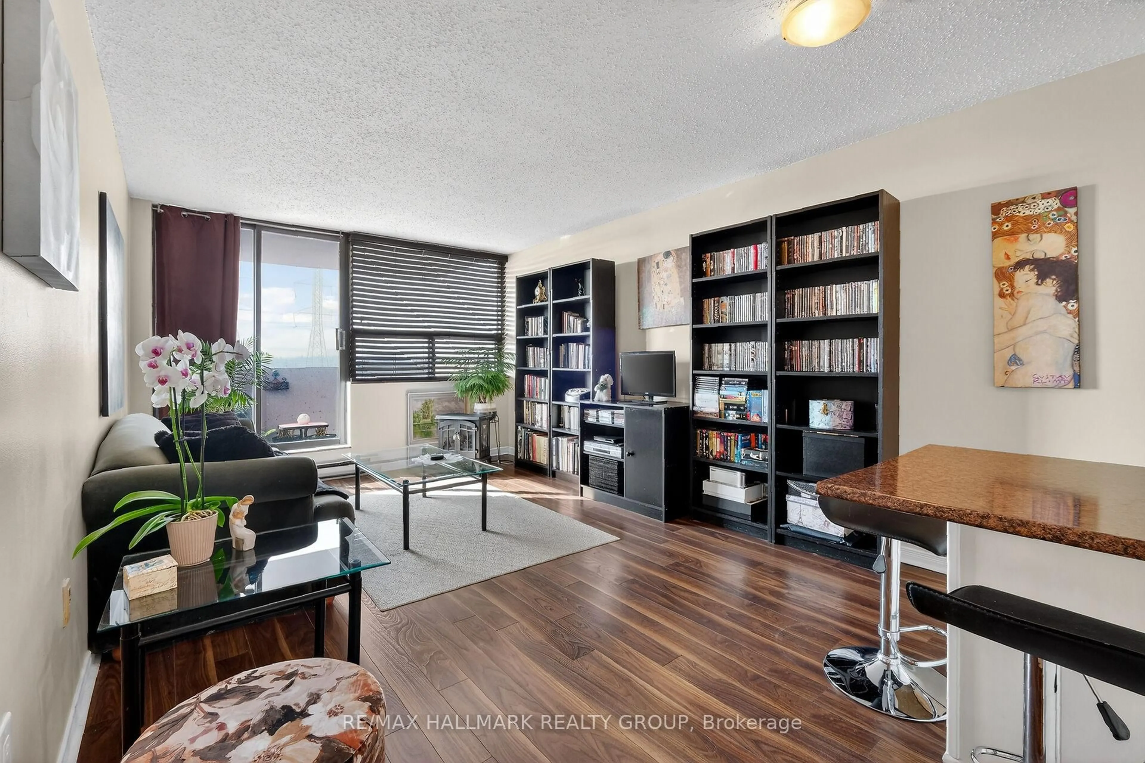 Living room with furniture, wood/laminate floor for 2019 Bank St #404, Ottawa Ontario K1V 0N1