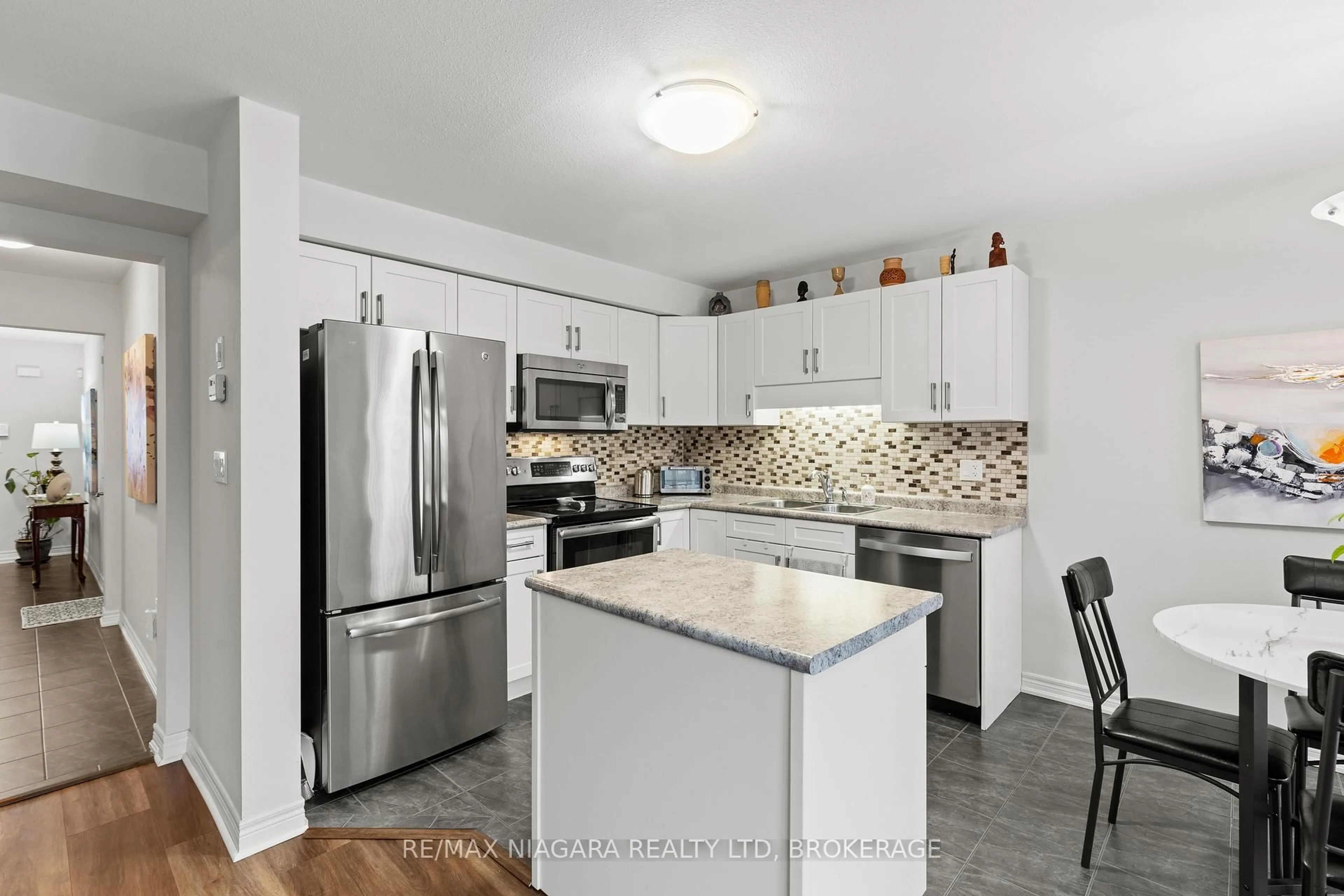 Open concept kitchen, ceramic/tile floor for 7728 Shaw St, Niagara Falls Ontario L2G 0H1