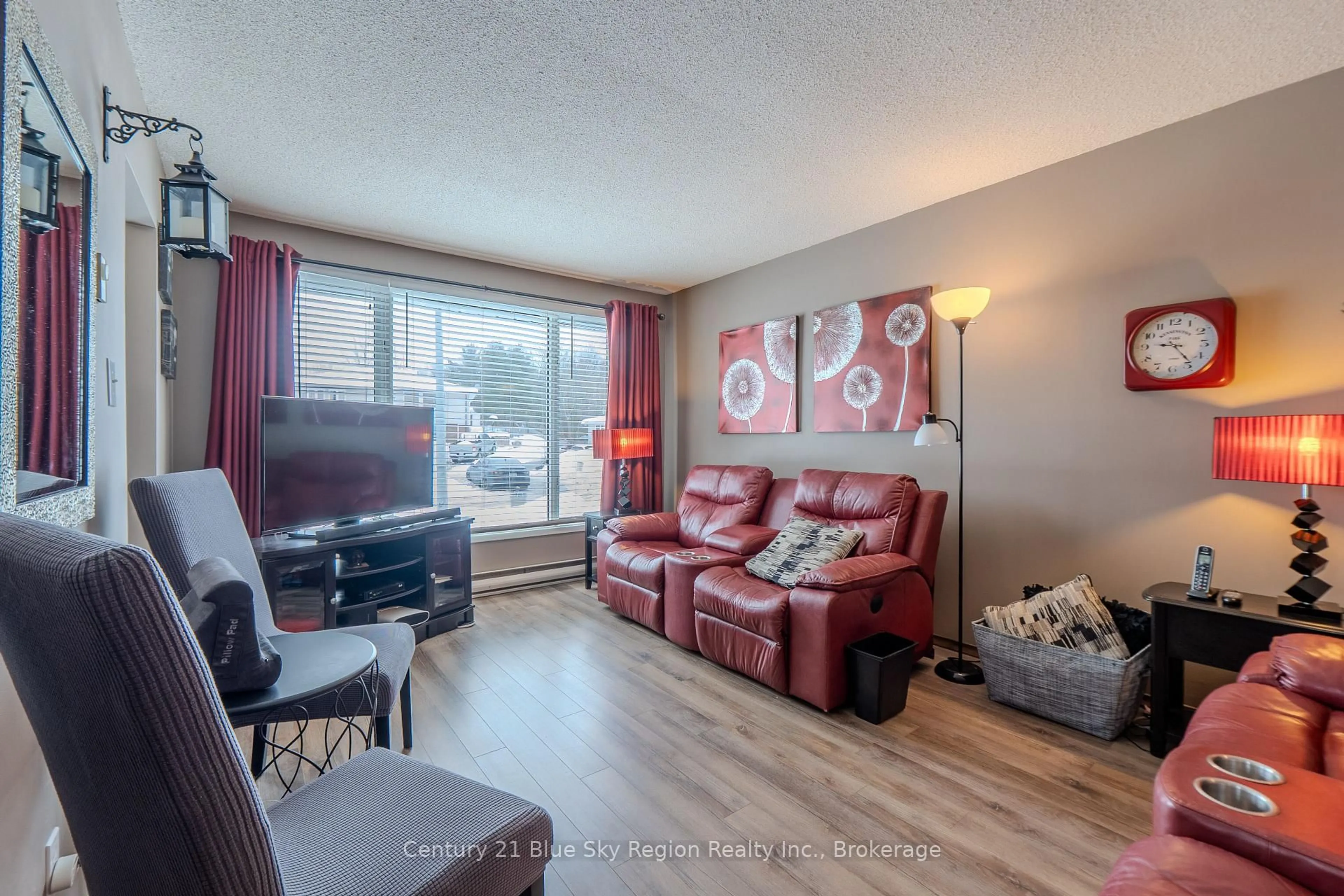 Living room with furniture, wood/laminate floor for 21 Rosedale Crt, North Bay Ontario P1A 3W1