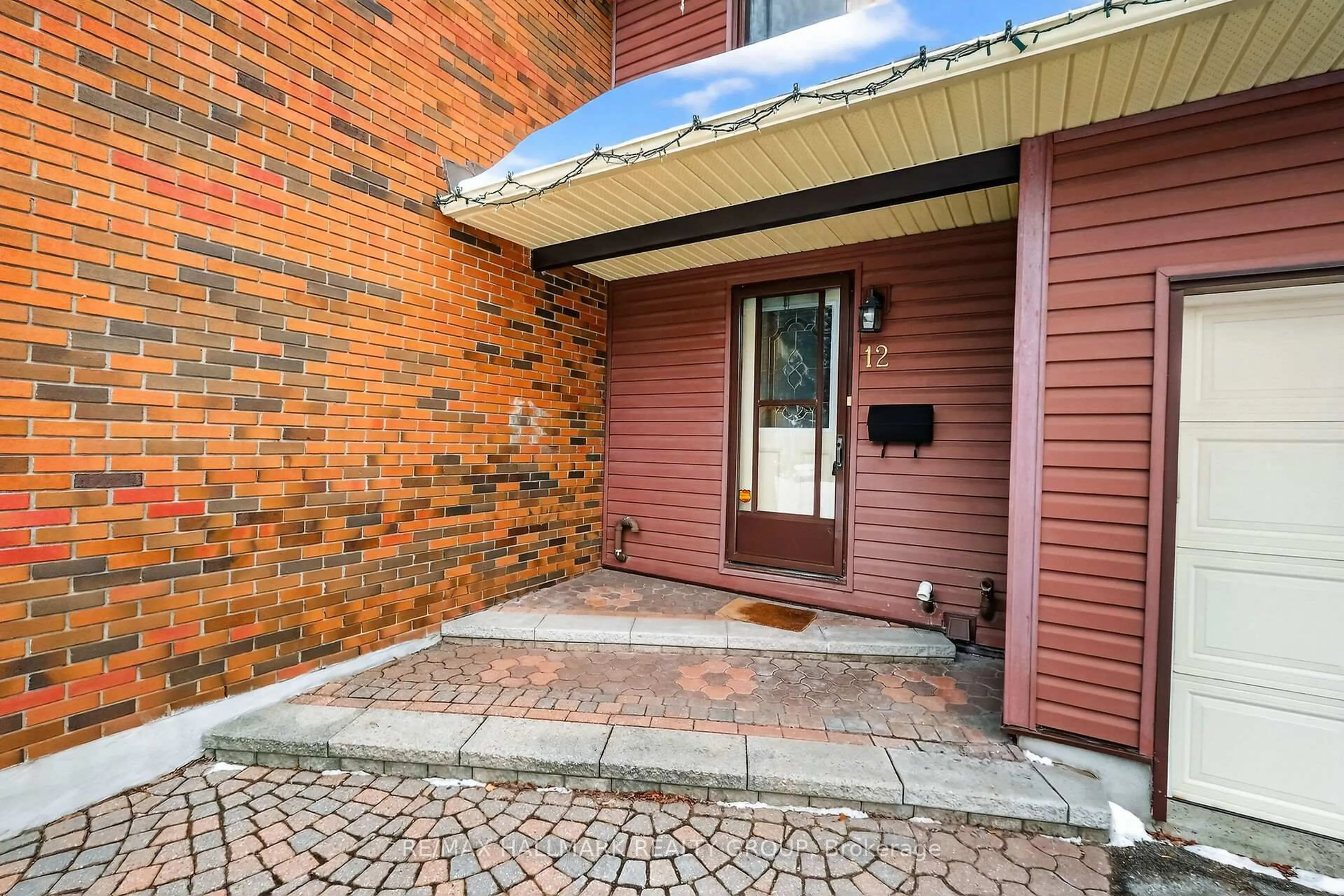Home with brick exterior material, street for 12 Black Forest Lane, Ottawa Ontario K2H 5C8