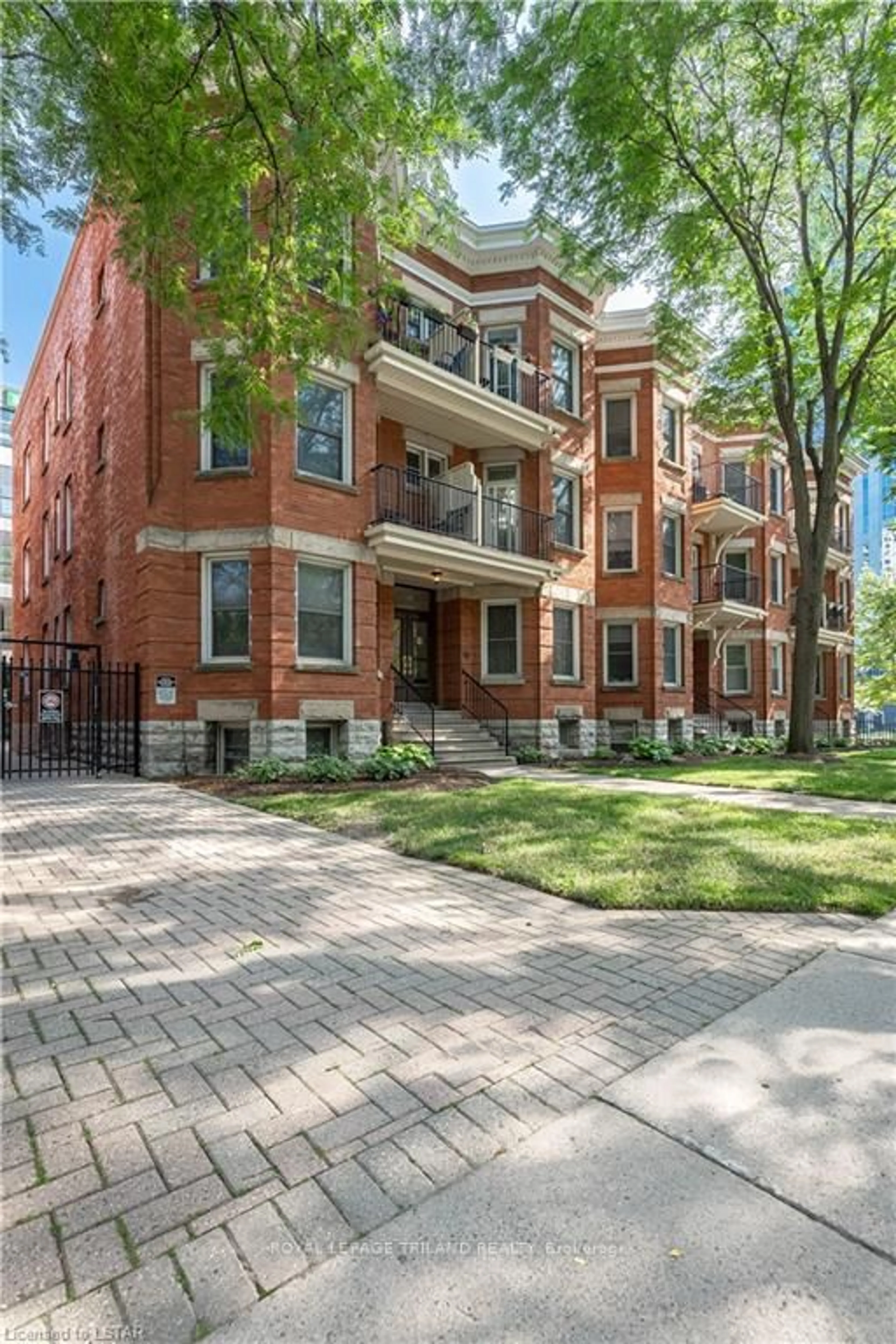 Home with brick exterior material, street for 275 Queens Ave #301, London East Ontario N6B 1X2