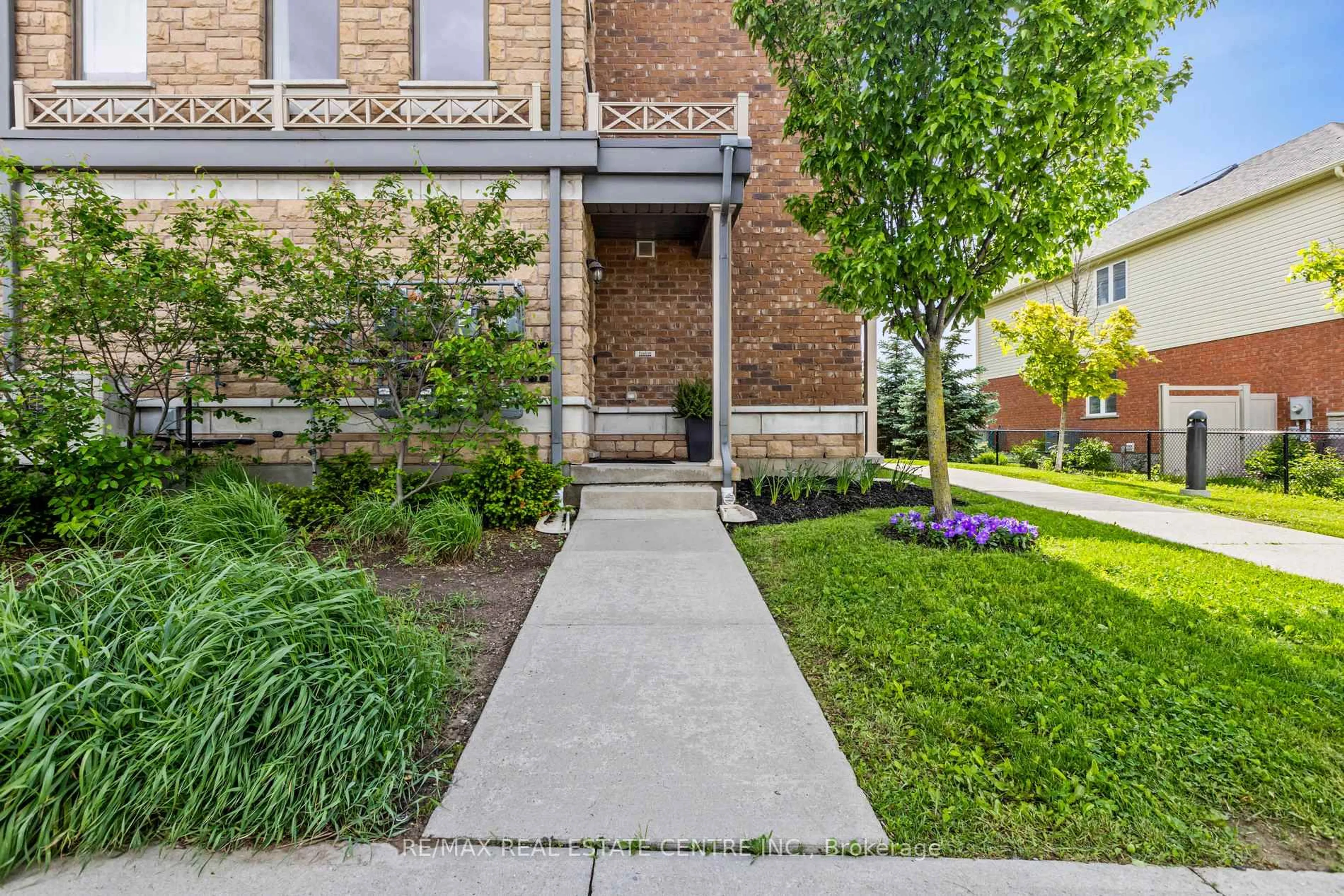 Home with brick exterior material, street for 70 Willowrun Dr #A1, Kitchener Ontario N2A 0J3