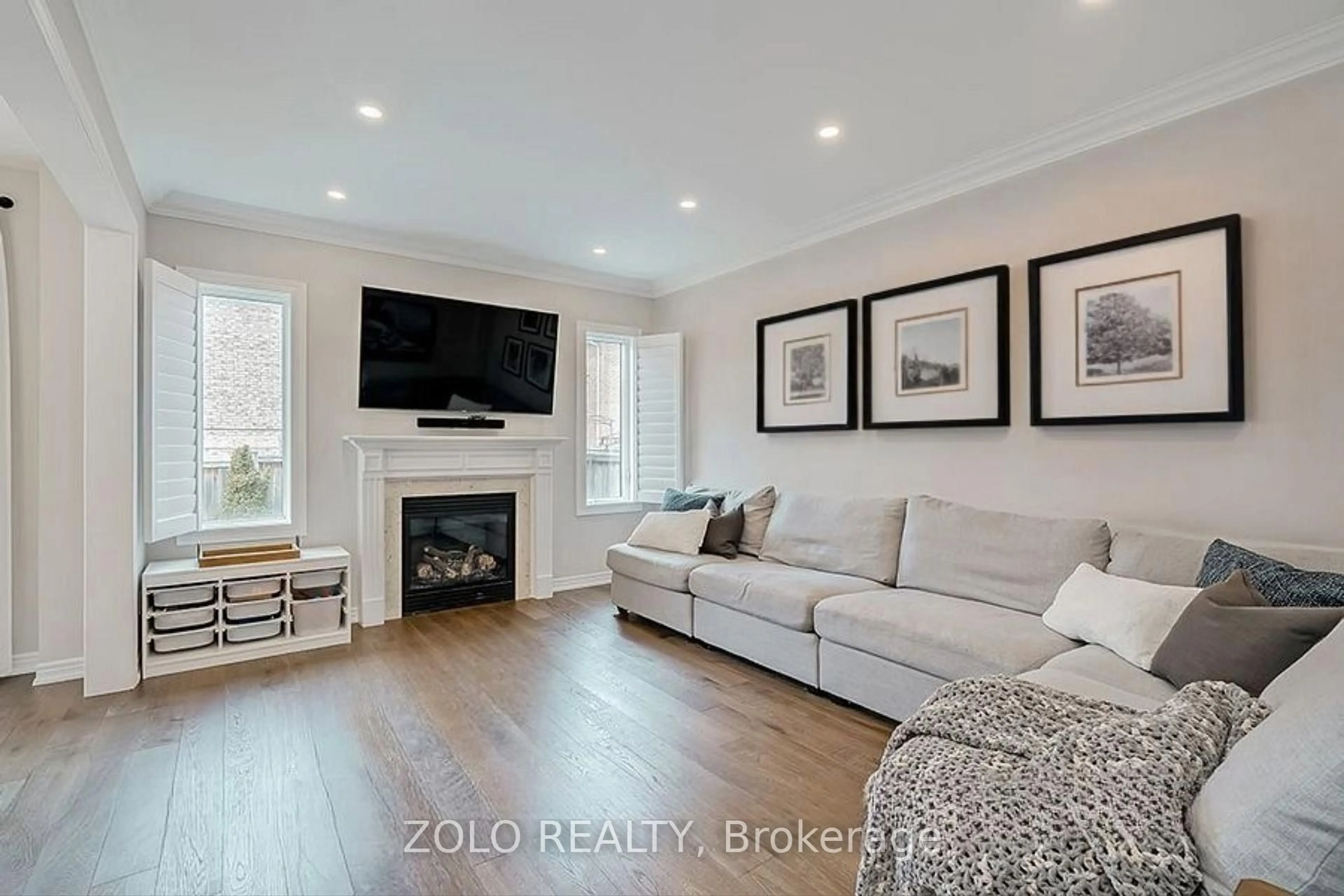 Living room with furniture, wood/laminate floor for 107 Attridge Cres, Hamilton Ontario L8B 0T9