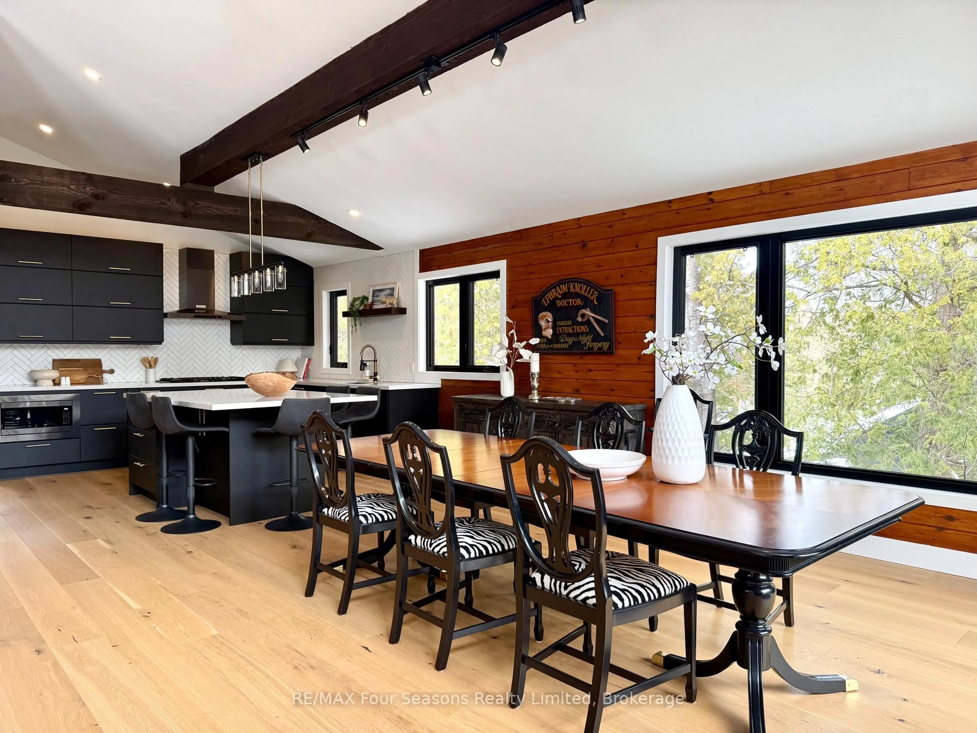 Open concept kitchen, wood/laminate floor for 131 Chamonix Cres, Blue Mountains Ontario L9Y 0S7