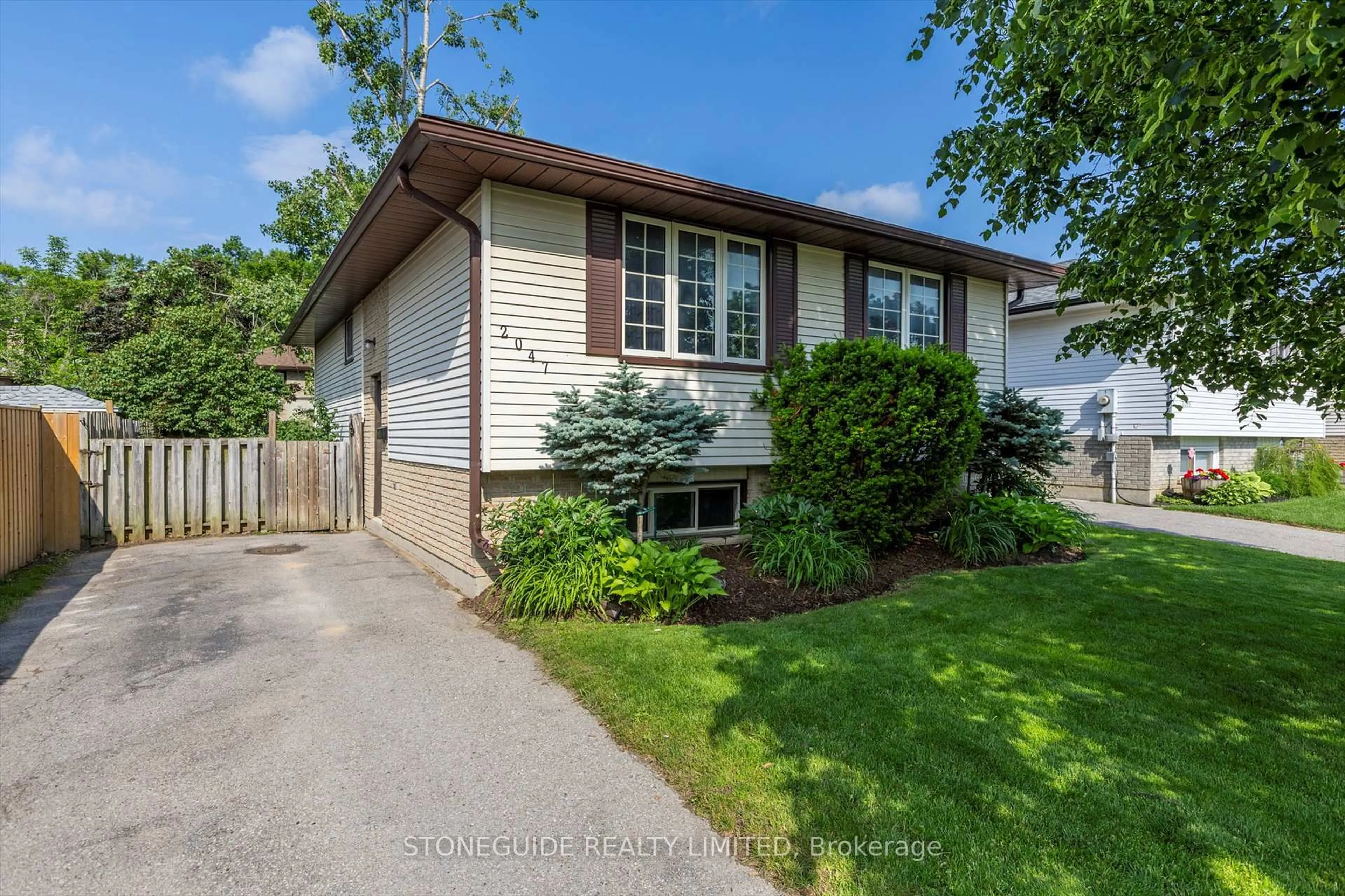 Home with vinyl exterior material, street for 2047 Foxfarm Rd, Peterborough Ontario K9K 1P8