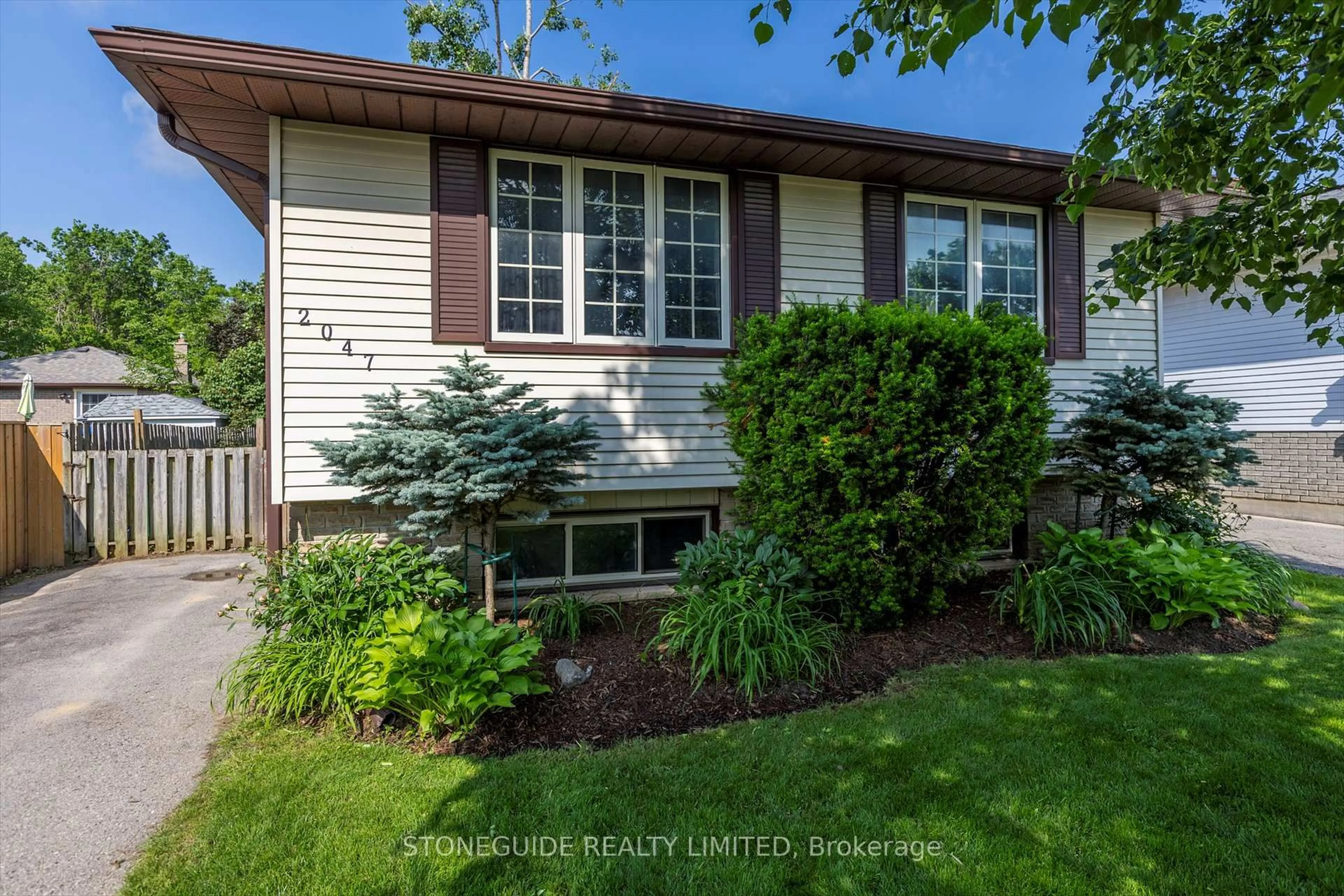 Home with vinyl exterior material, street for 2047 Foxfarm Rd, Peterborough Ontario K9K 1P8