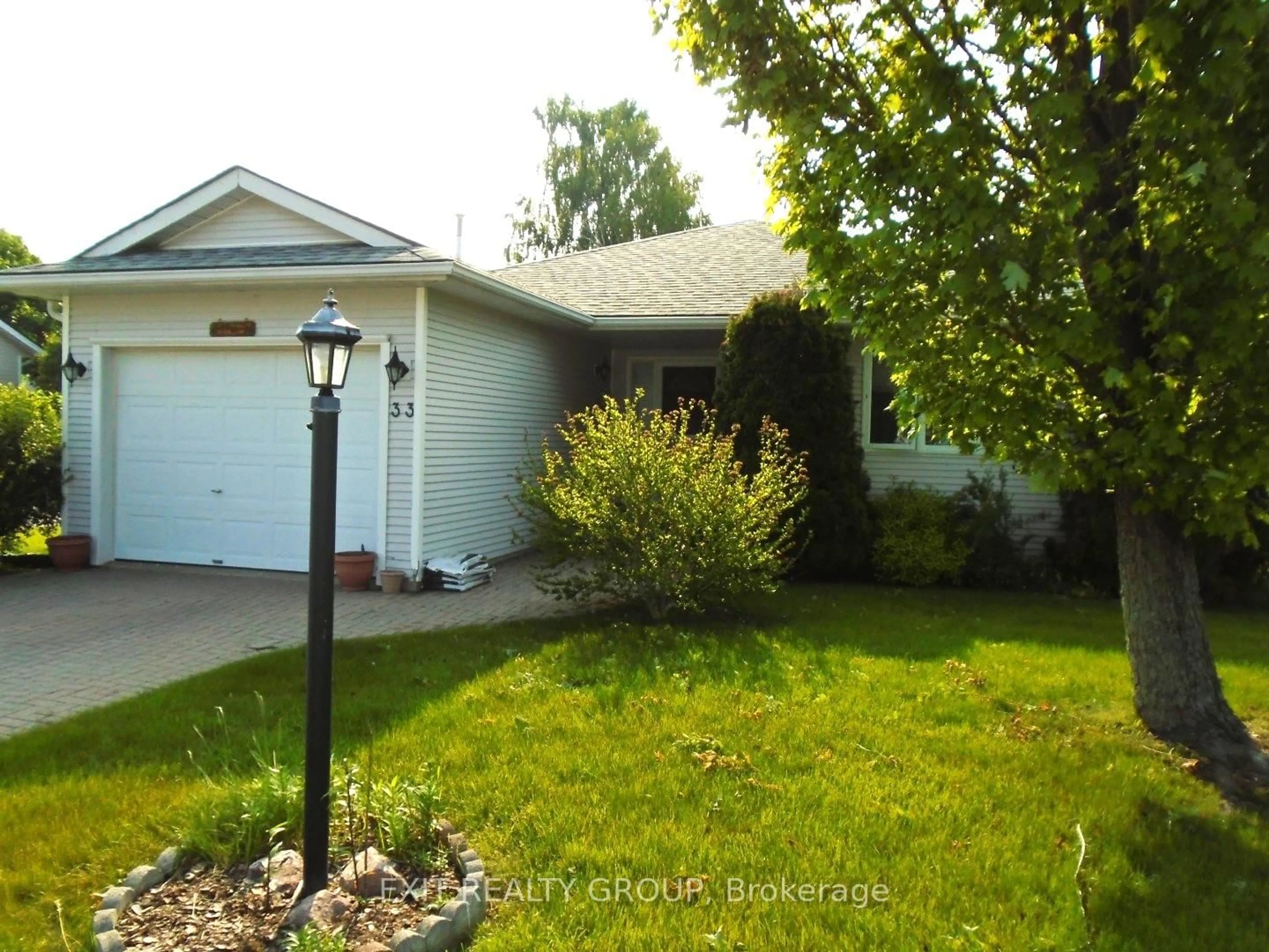 Home with vinyl exterior material, street for 33 Cretney Dr, Prince Edward County Ontario K0K 3L0