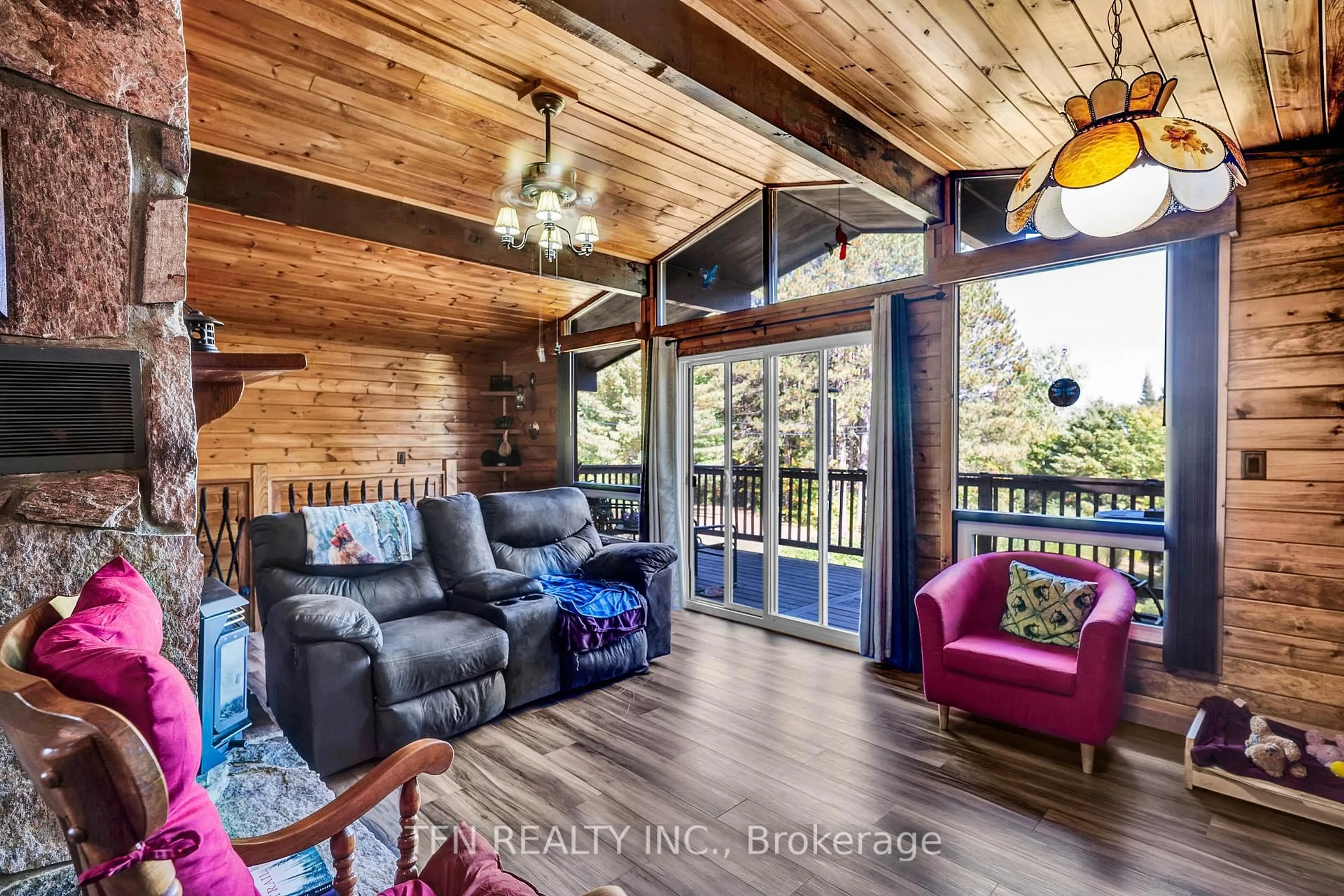 Living room with furniture, wood/laminate floor for 110 Machar Strong Boundary Rd, Machar Ontario P0A 1X0