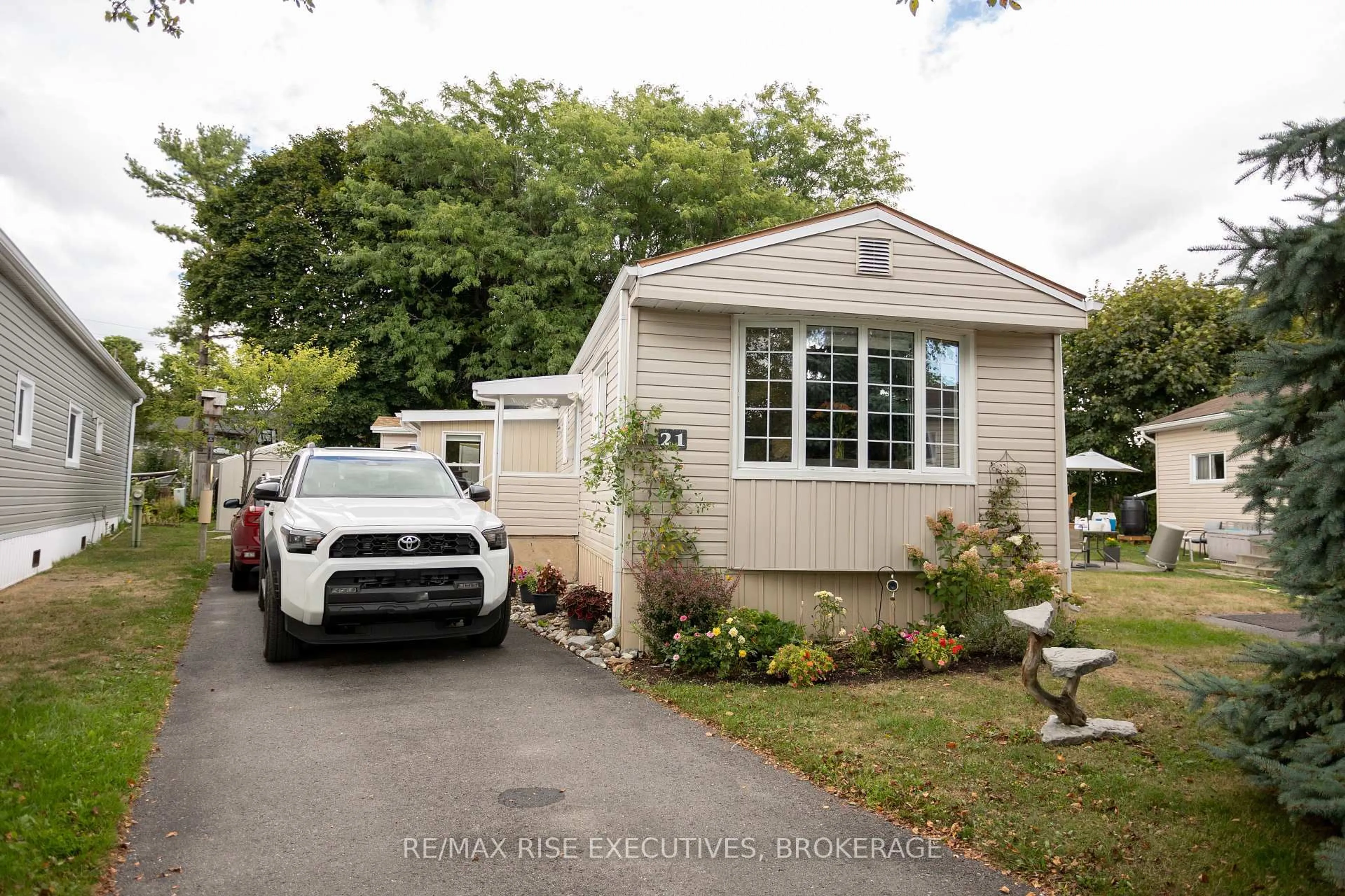 Home with vinyl exterior material, street for 21 Powley Garden Dr, Kingston Ontario K7K 6A2