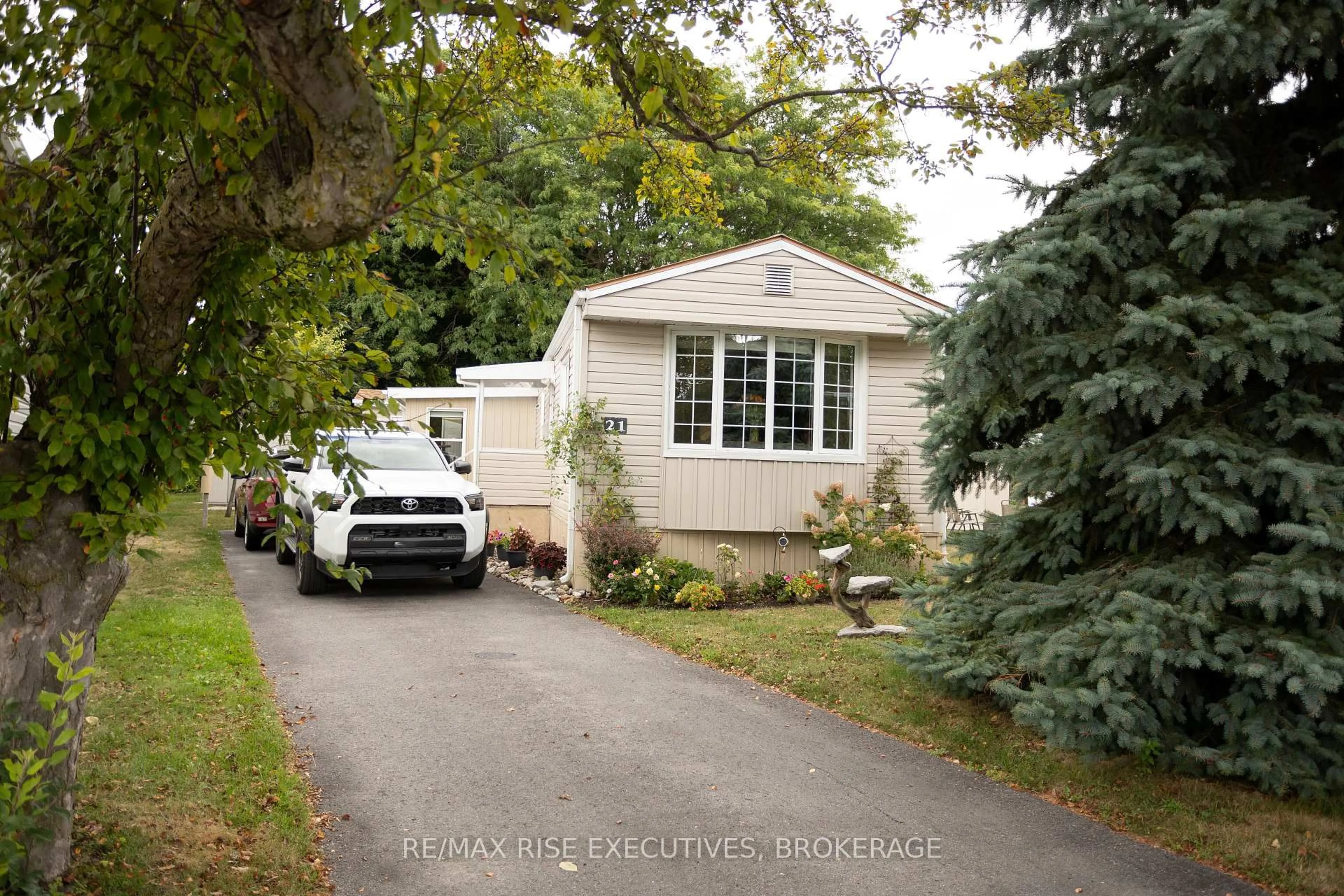 Home with vinyl exterior material, street for 21 Powley Garden Dr, Kingston Ontario K7K 6A2