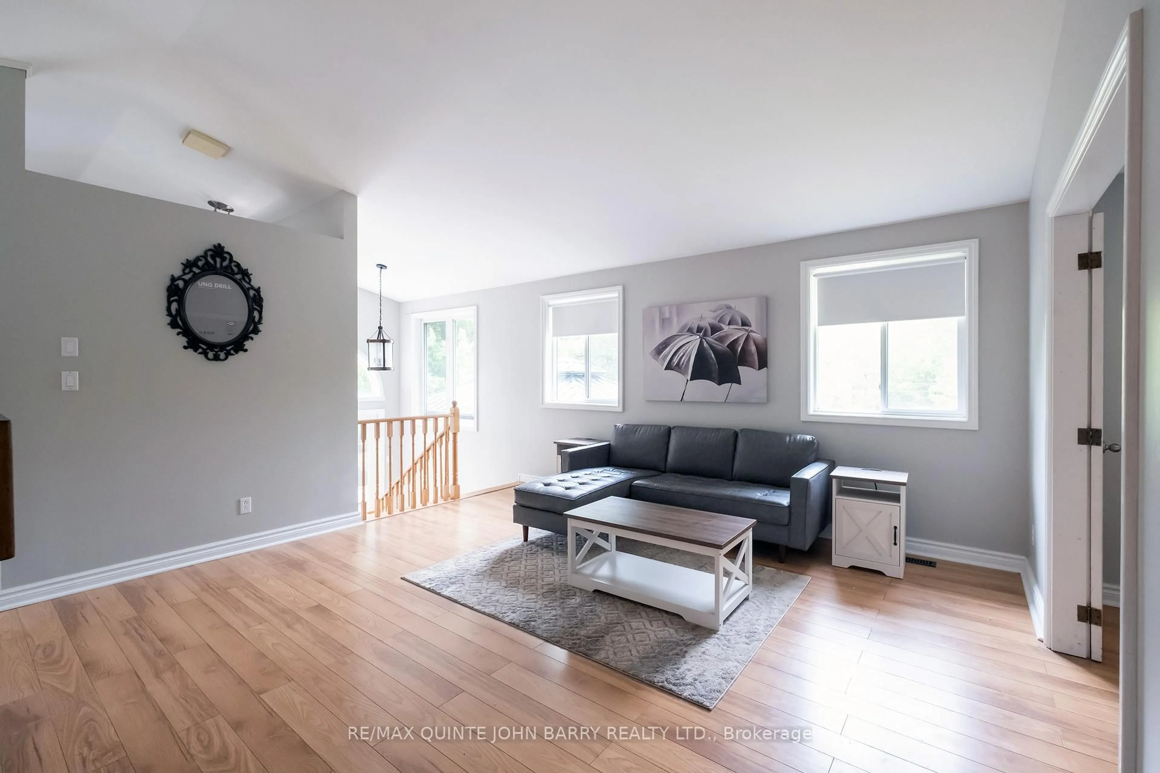 Living room with furniture, wood/laminate floor for 524 Christiani Rd, Ingleside Ontario K8V 5P4