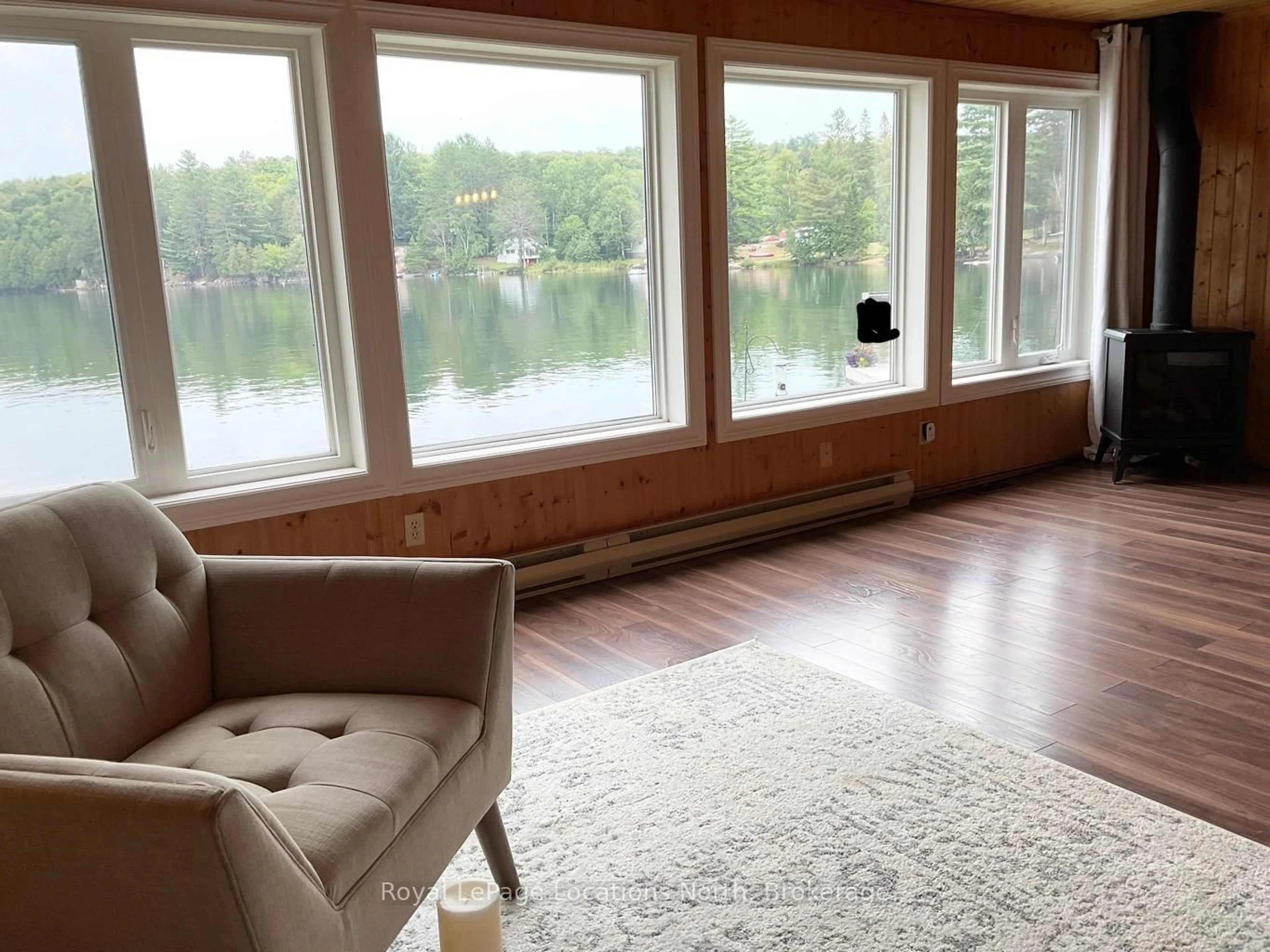 Living room with furniture, wood/laminate floor for 1433 South Horn Lk Rd, Ryerson Ontario P0A 1C0