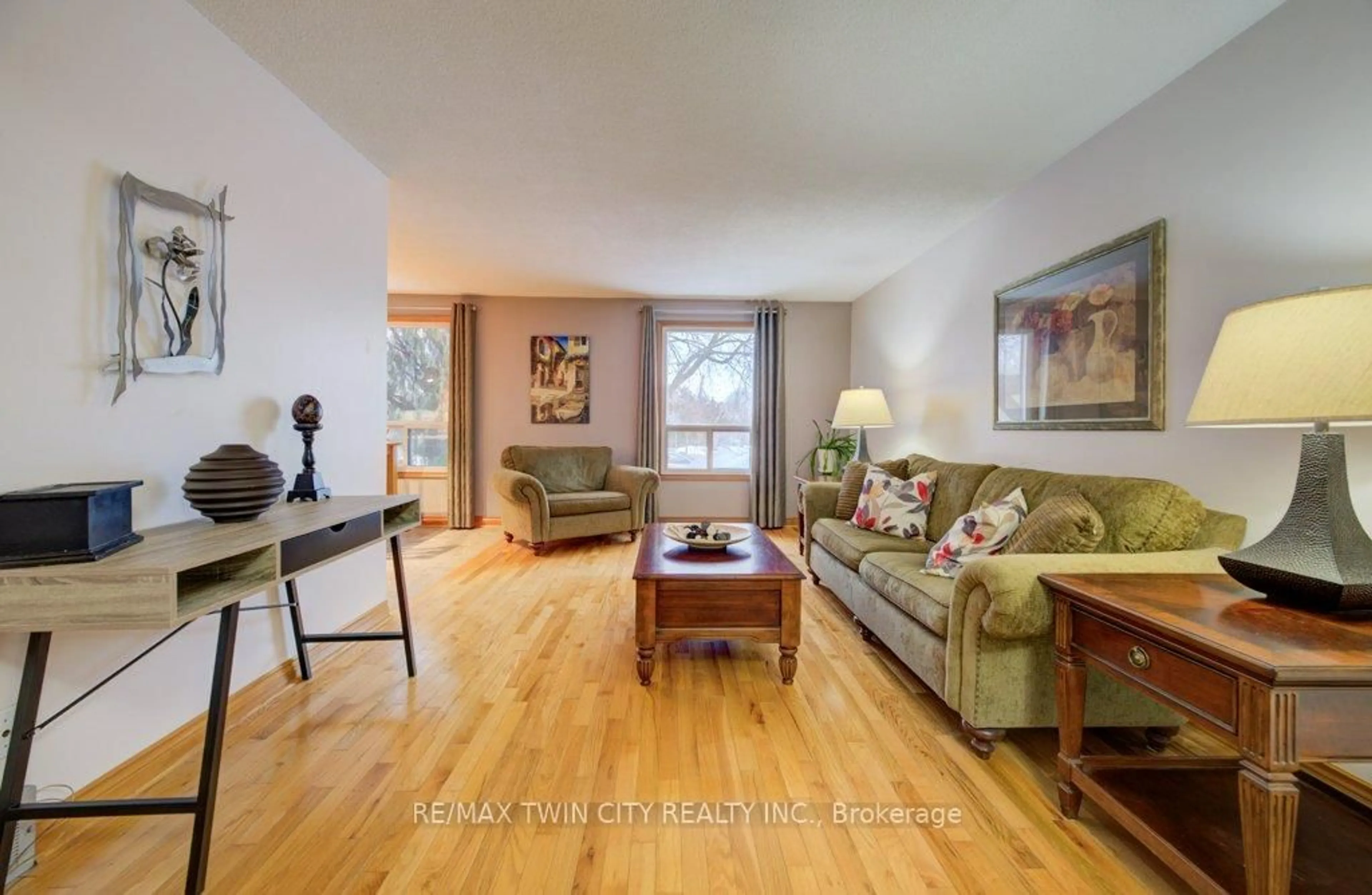 Living room with furniture, wood/laminate floor for 27 Erinbrook Dr, Kitchener Ontario N2E 2V8