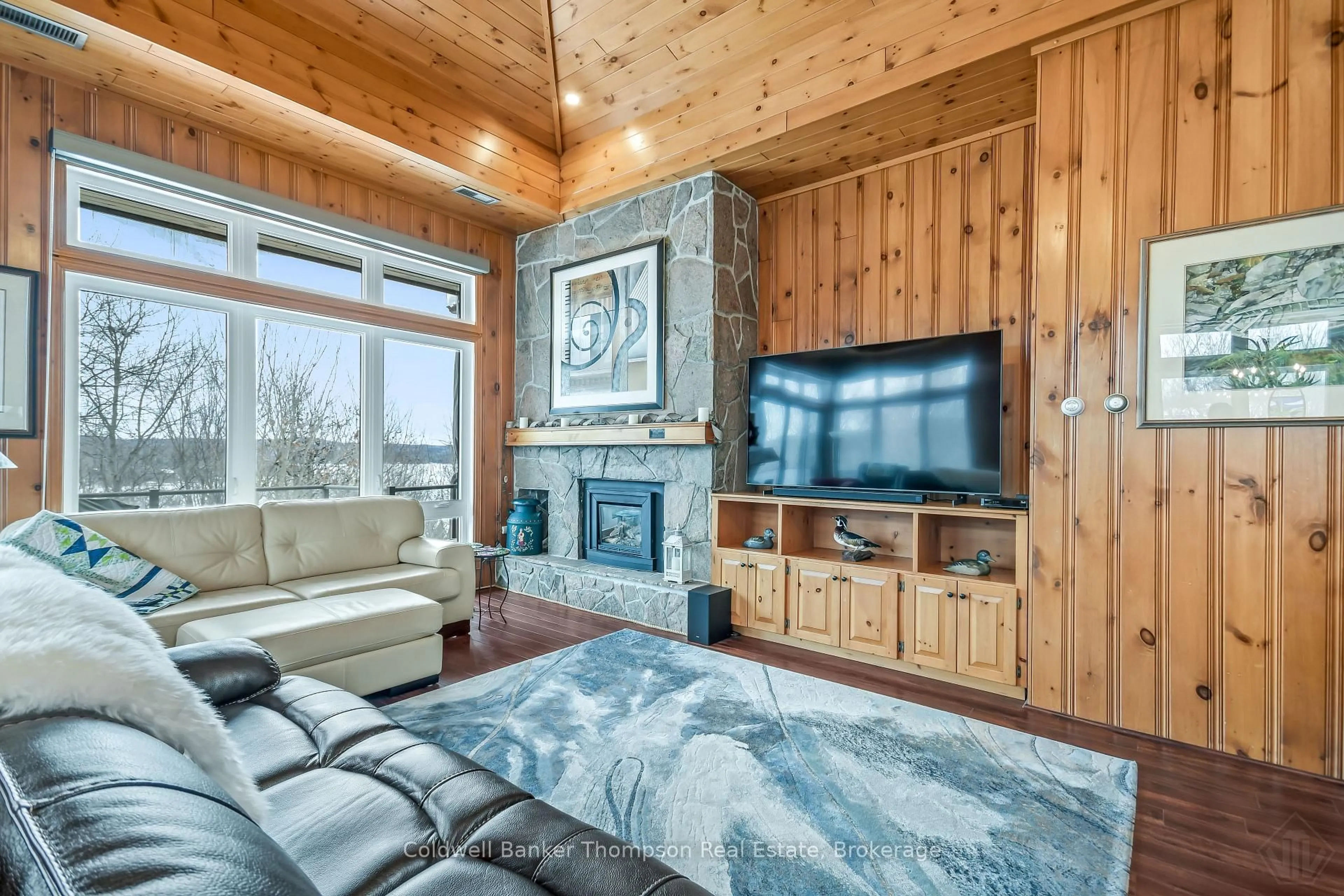 Living room with furniture, wood/laminate floor for 22-301 Oakridge Deerhurst Dr, Huntsville Ontario P1H 2E8