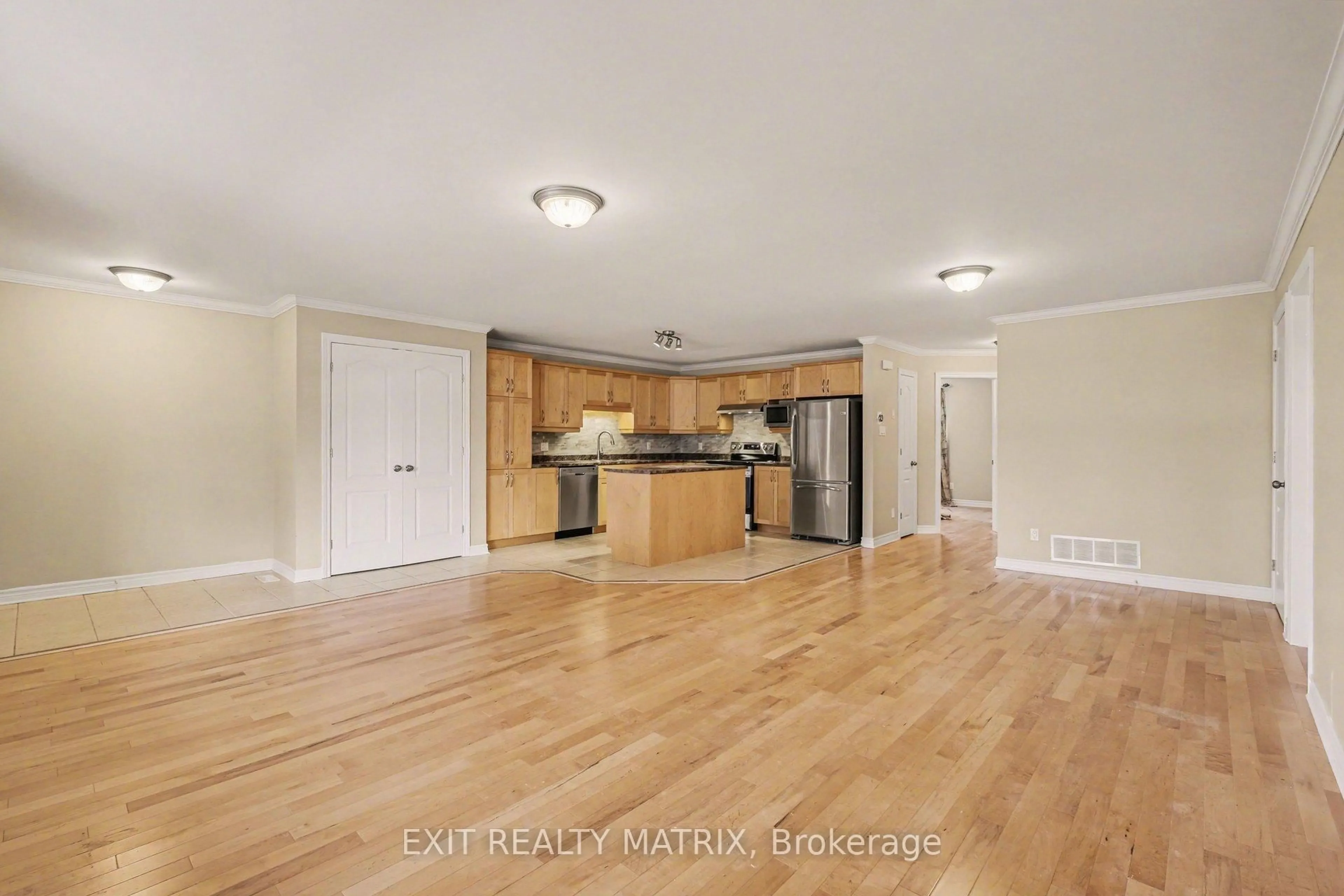Open concept kitchen, wood/laminate floor for 856 Notre-Dame St #103, Russell Ontario K0A 1W0