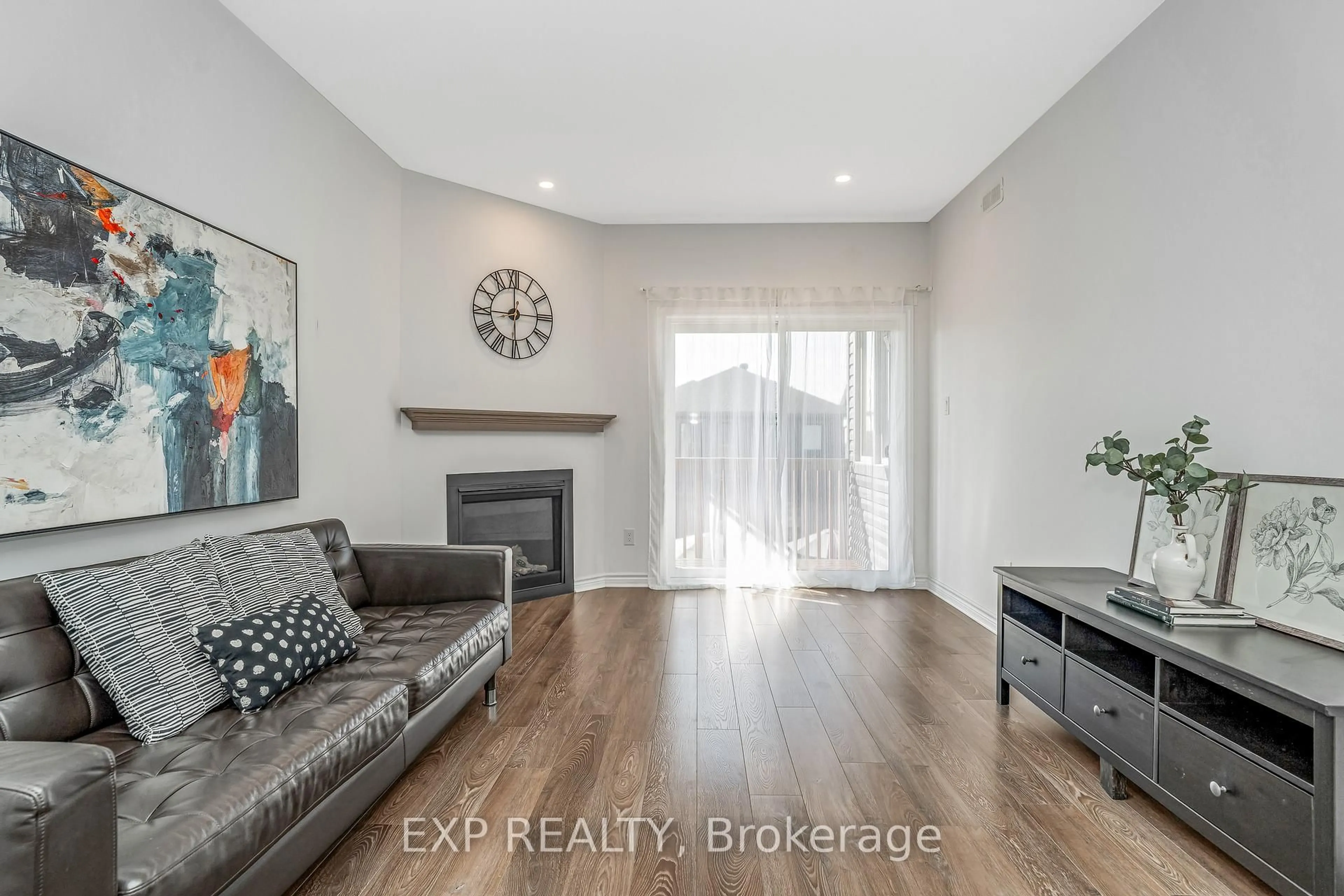 Living room with furniture, wood/laminate floor for 72 Dun Skipper Dr, Ottawa Ontario K1X 0E8