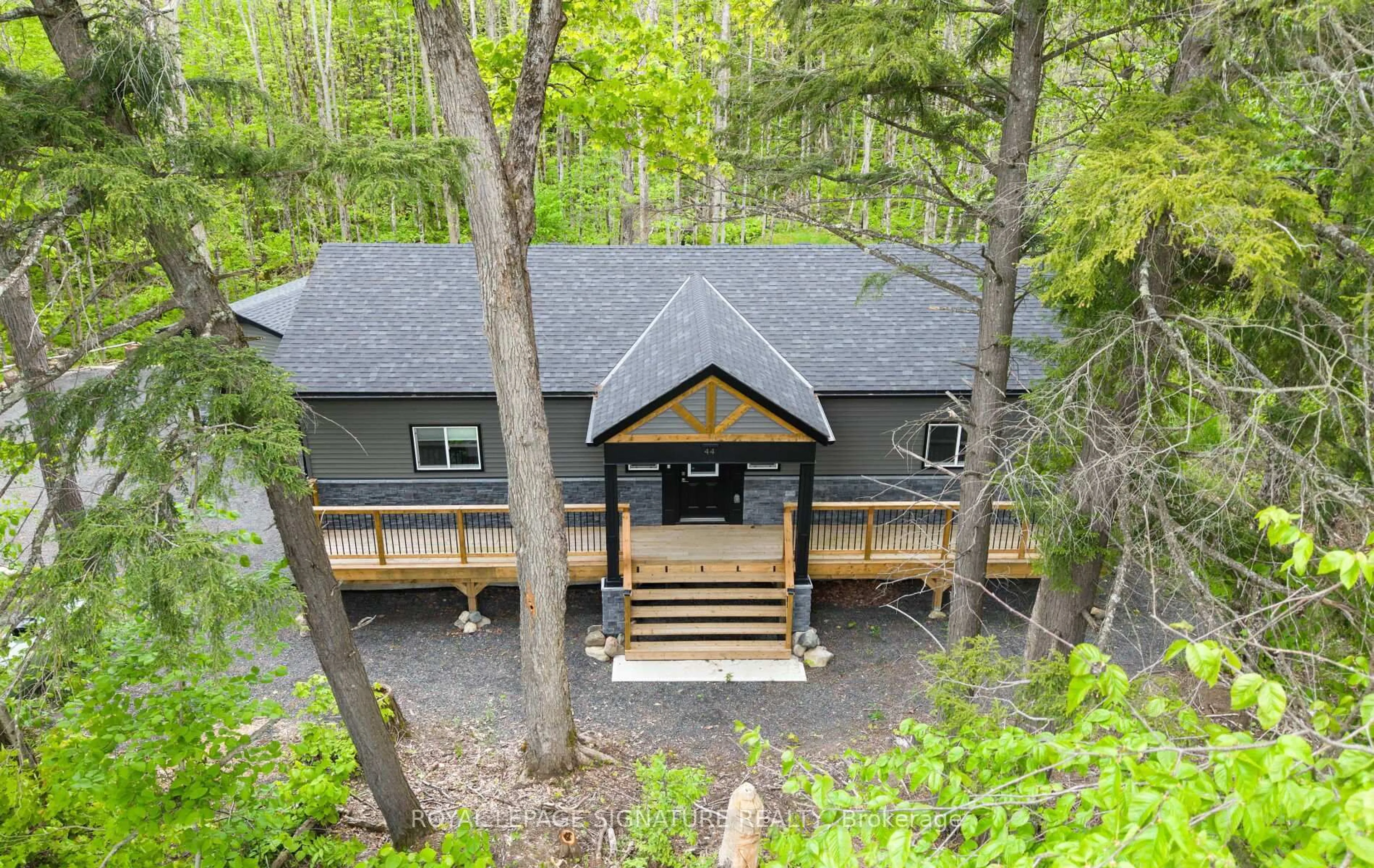 A pic from outside/outdoor area/front of a property/back of a property/a pic from drone, forest/trees view for 44 Sunnyshore Park Dr, McKellar Ontario P2A 0B5