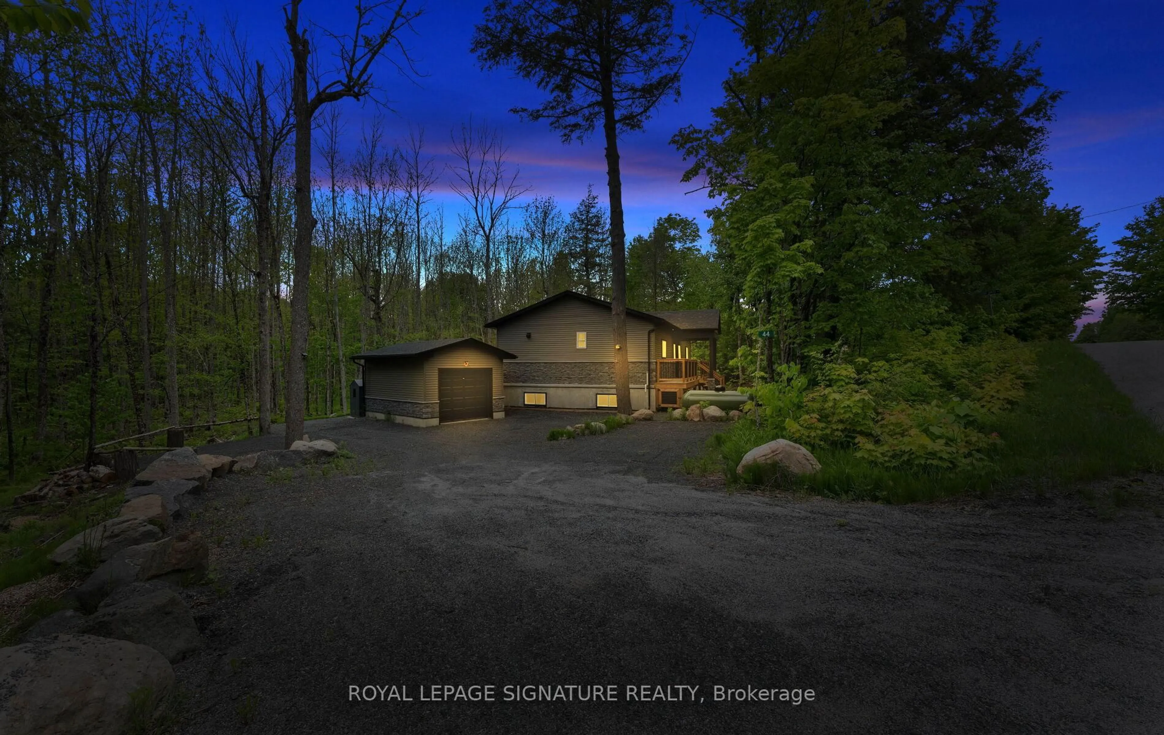 A pic from outside/outdoor area/front of a property/back of a property/a pic from drone, forest/trees view for 44 Sunnyshore Park Dr, McKellar Ontario P2A 0B5