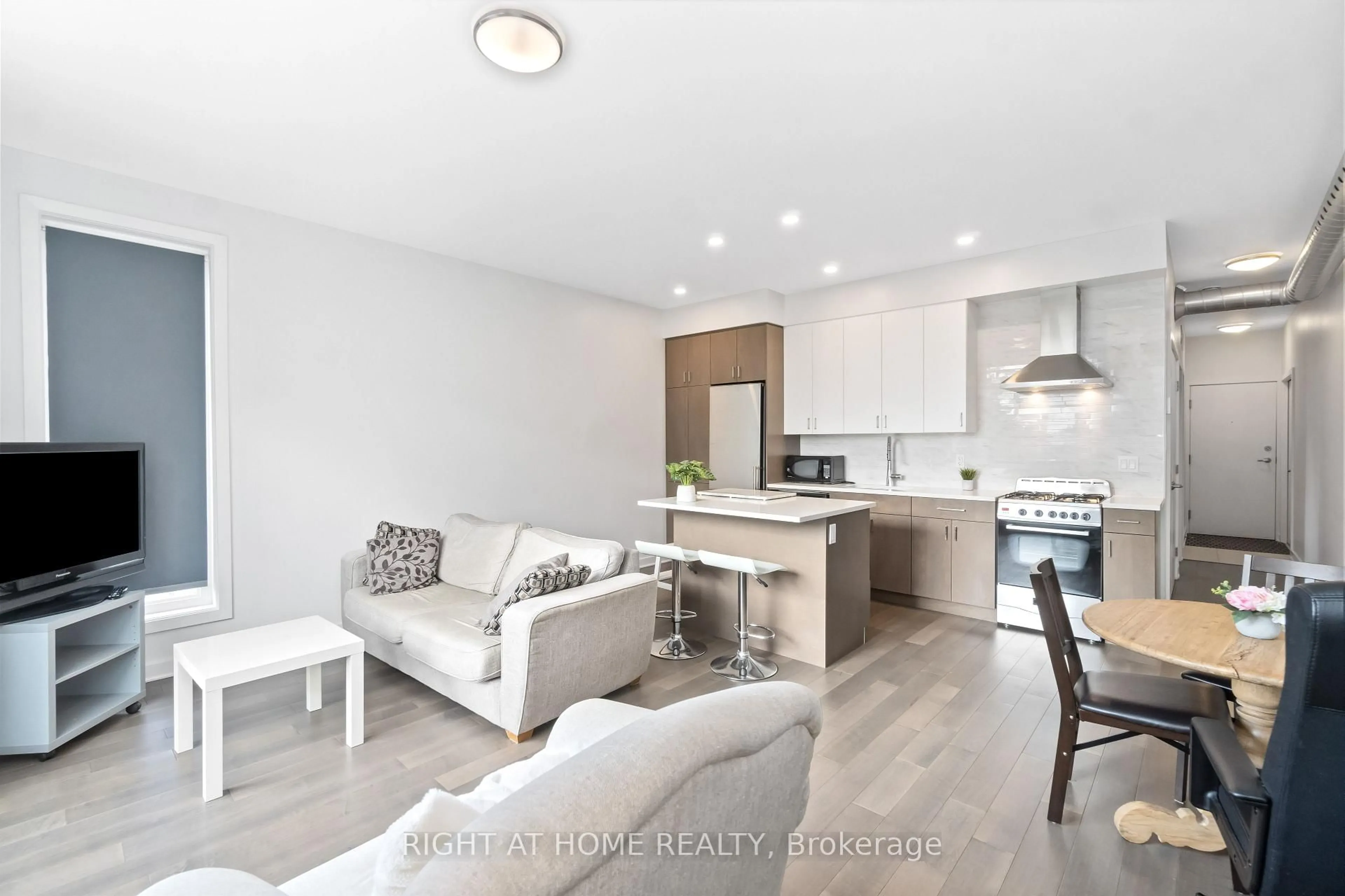 Open concept kitchen, wood/laminate floor for 22 Perkins St #305, Ottawa Ontario K1R 7G5