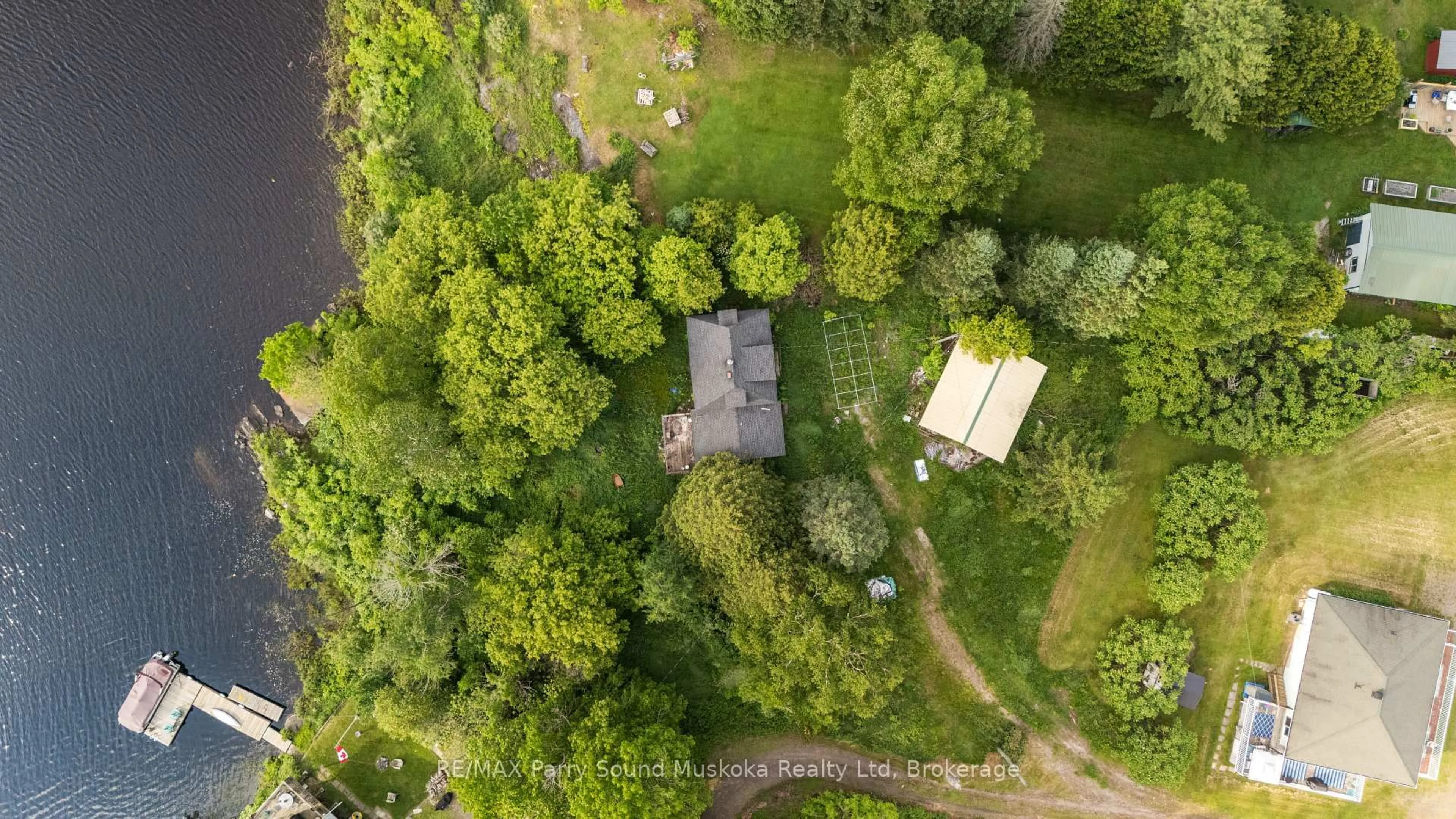 A pic from outside/outdoor area/front of a property/back of a property/a pic from drone, forest/trees view for 5 Bellview Cres, Whitestone Ontario P0A 1G0