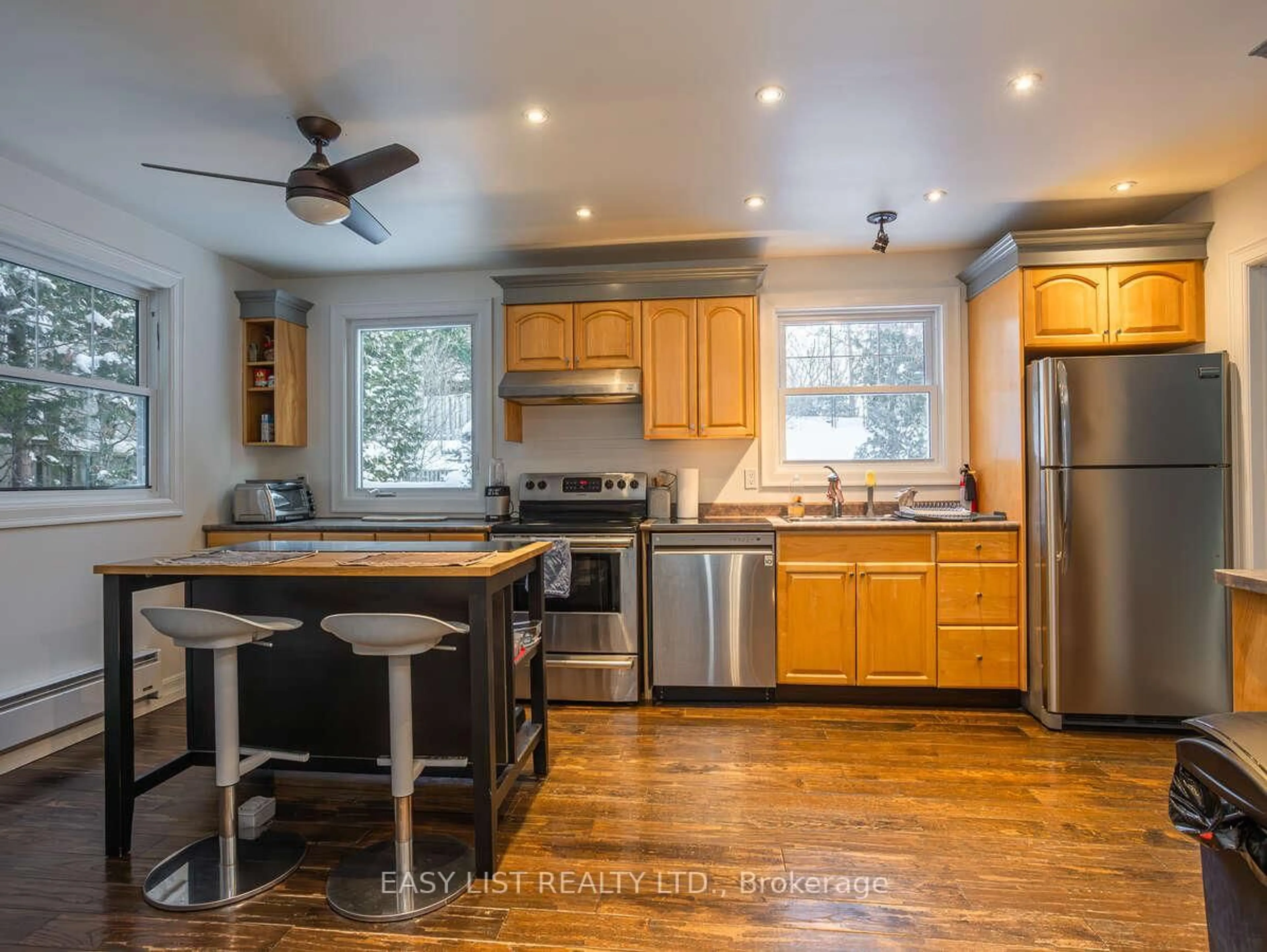 Open concept kitchen, wood/laminate floor for 73 Hobart Cres, Ottawa Ontario K2H 5S3