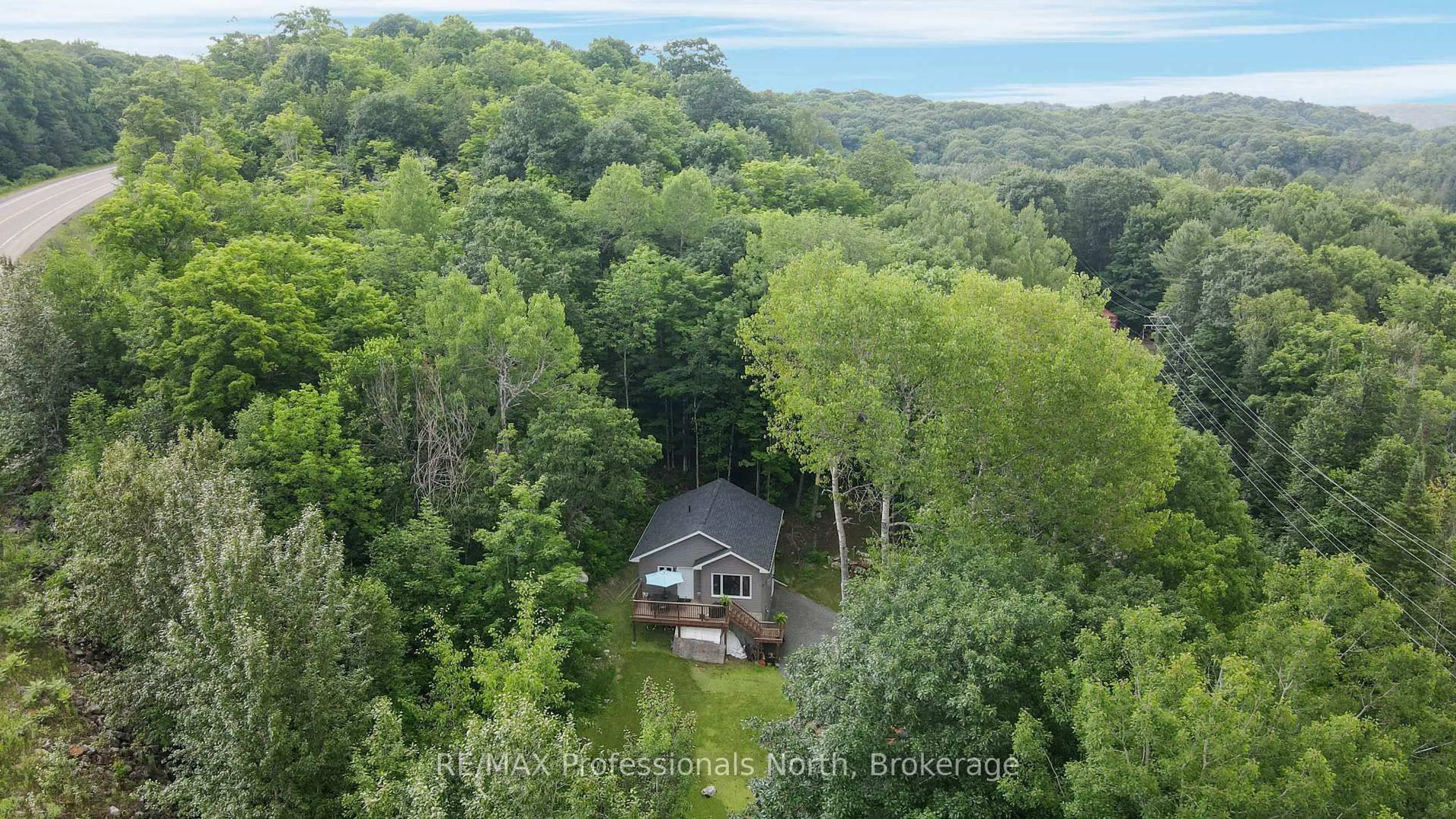 A pic from outside/outdoor area/front of a property/back of a property/a pic from drone, water/lake/river/ocean view for 1065 Henderson's Rd, Minden Hills Ontario K0M 2S0