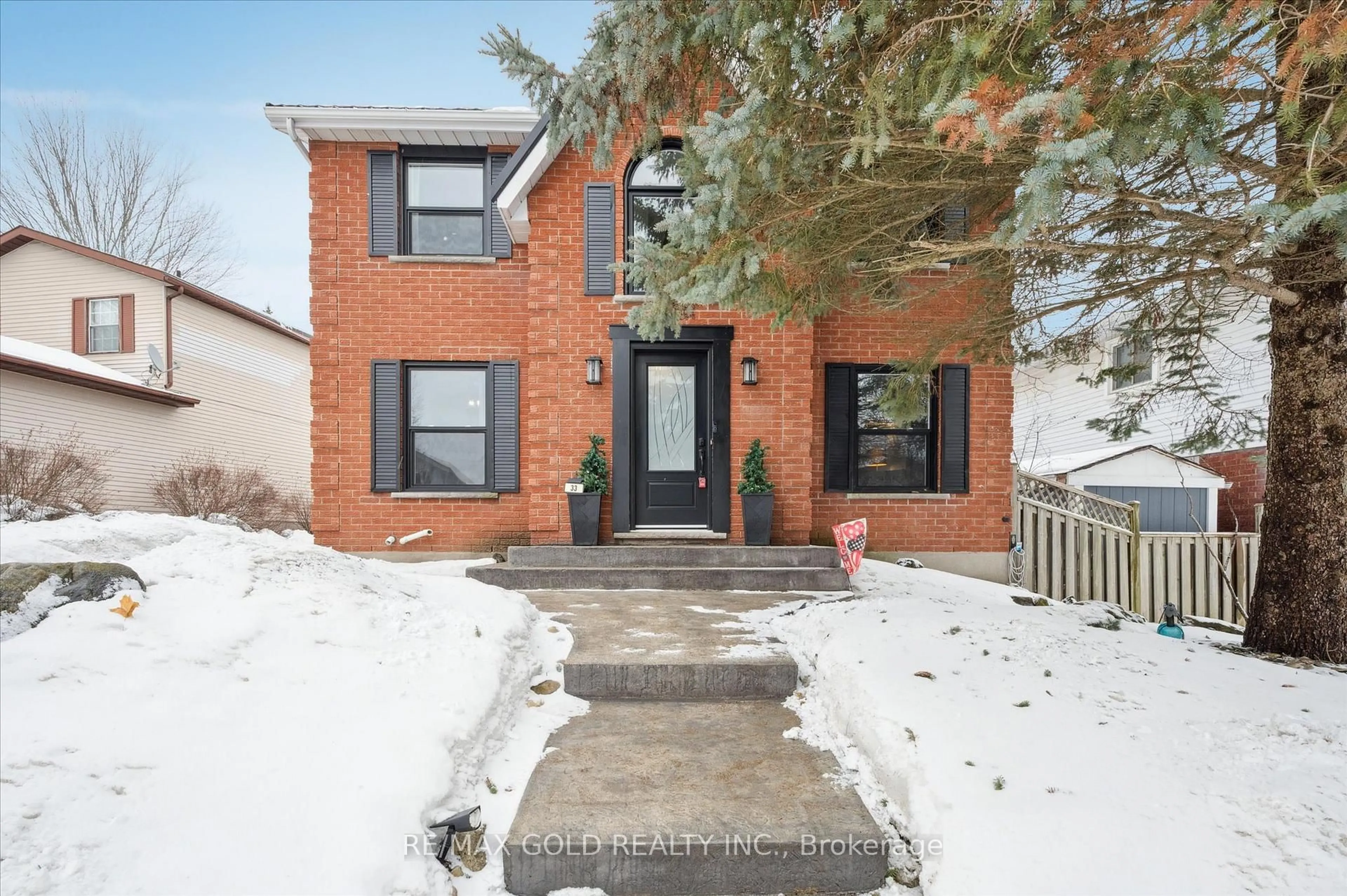 Home with brick exterior material, street for 33 Chesterton Lane, Guelph Ontario N1E 6S8