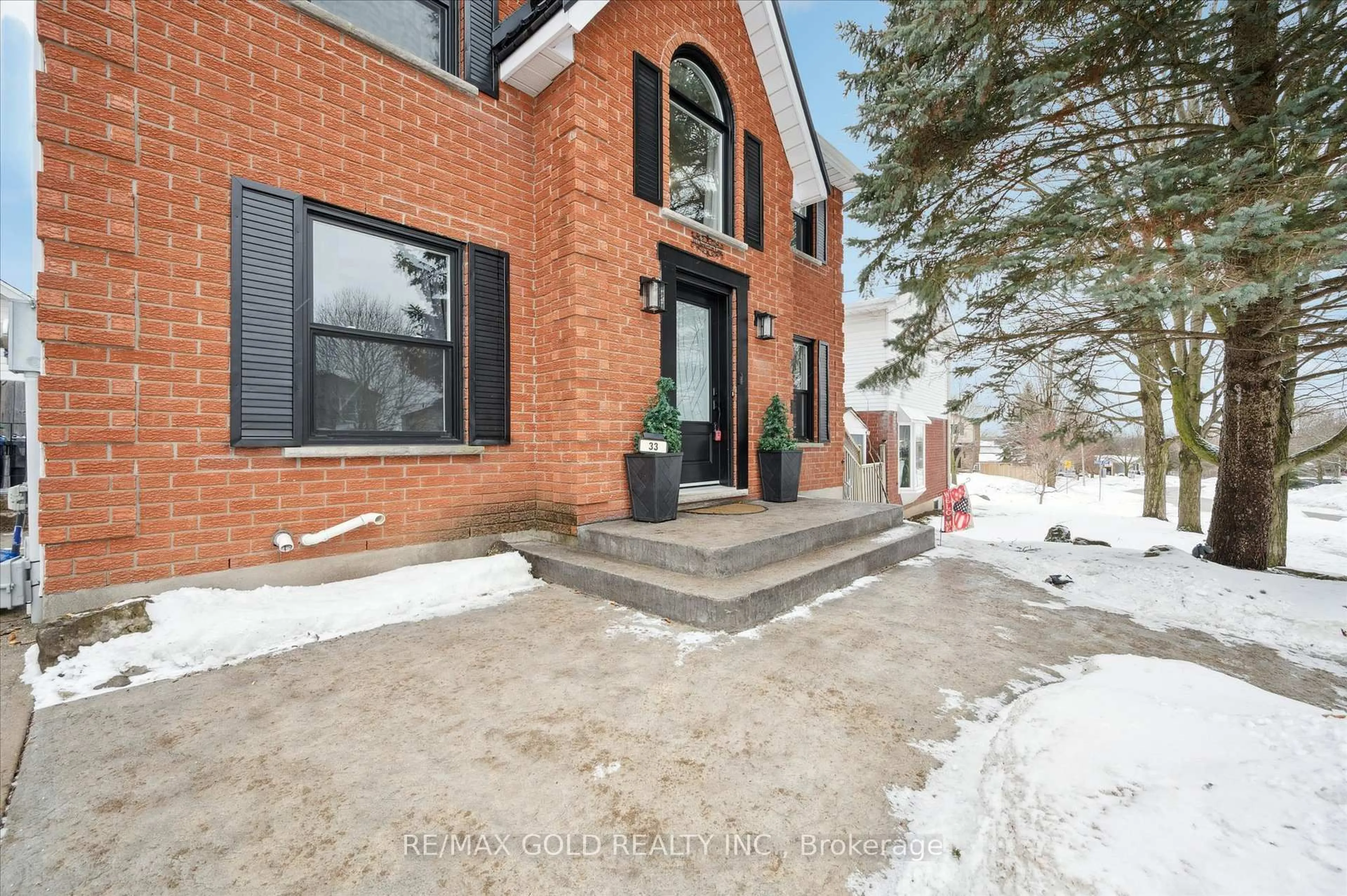 Home with brick exterior material, street for 33 Chesterton Lane, Guelph Ontario N1E 6S8
