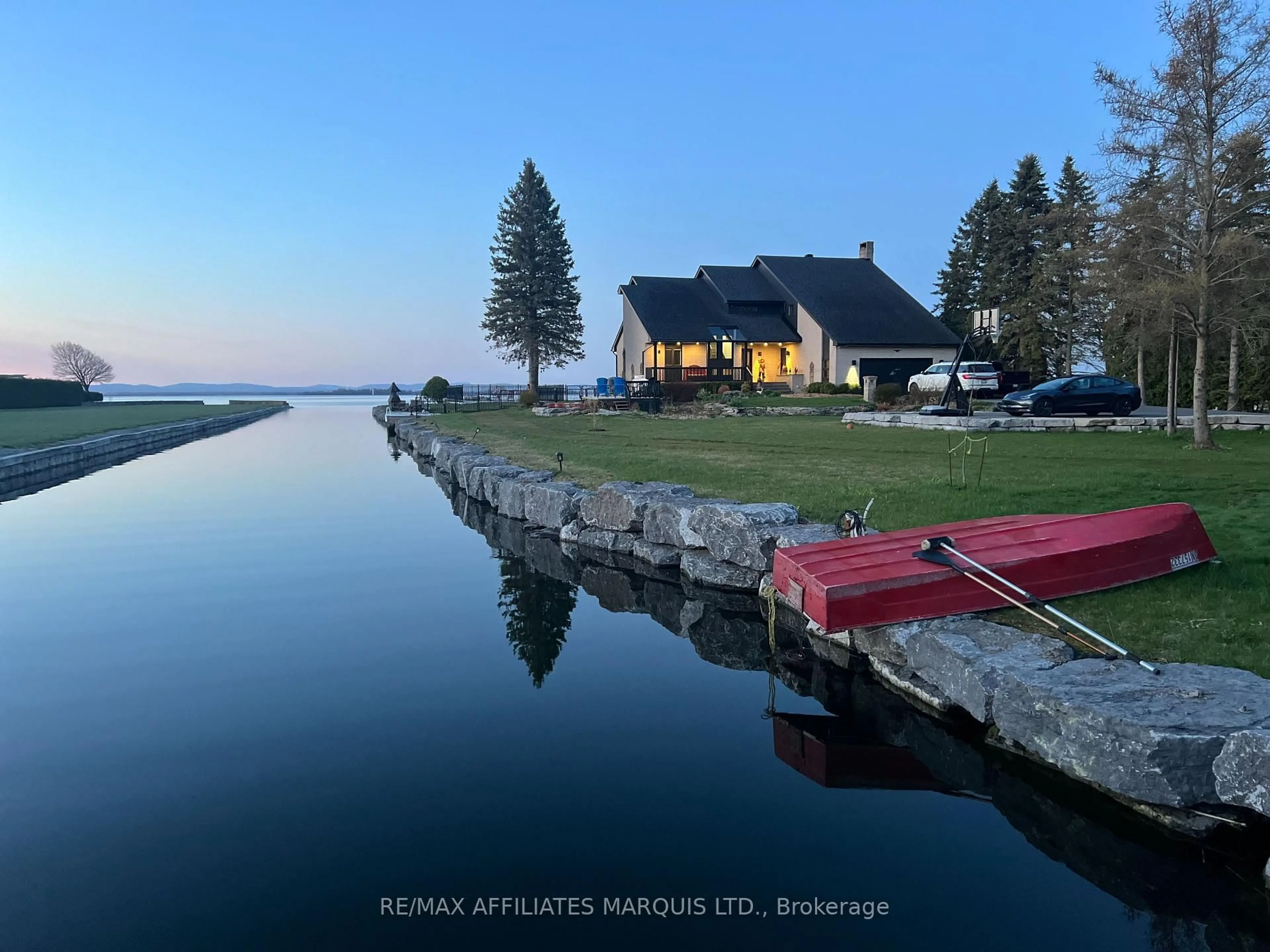 A pic from outside/outdoor area/front of a property/back of a property/a pic from drone, water/lake/river/ocean view for 20214 County Rd 2 Rd, South Glengarry Ontario K0C 2E0