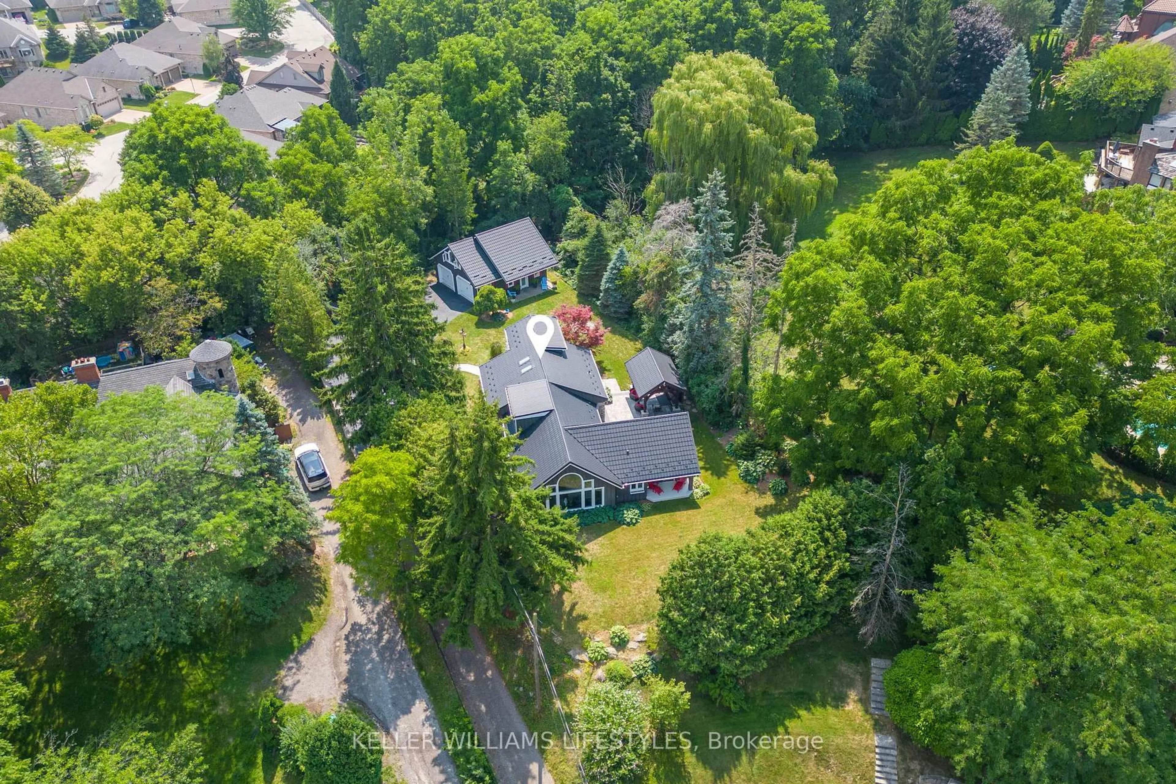 A pic from outside/outdoor area/front of a property/back of a property/a pic from drone, forest/trees view for 515 Jarvis St, London South Ontario N6K 1X3