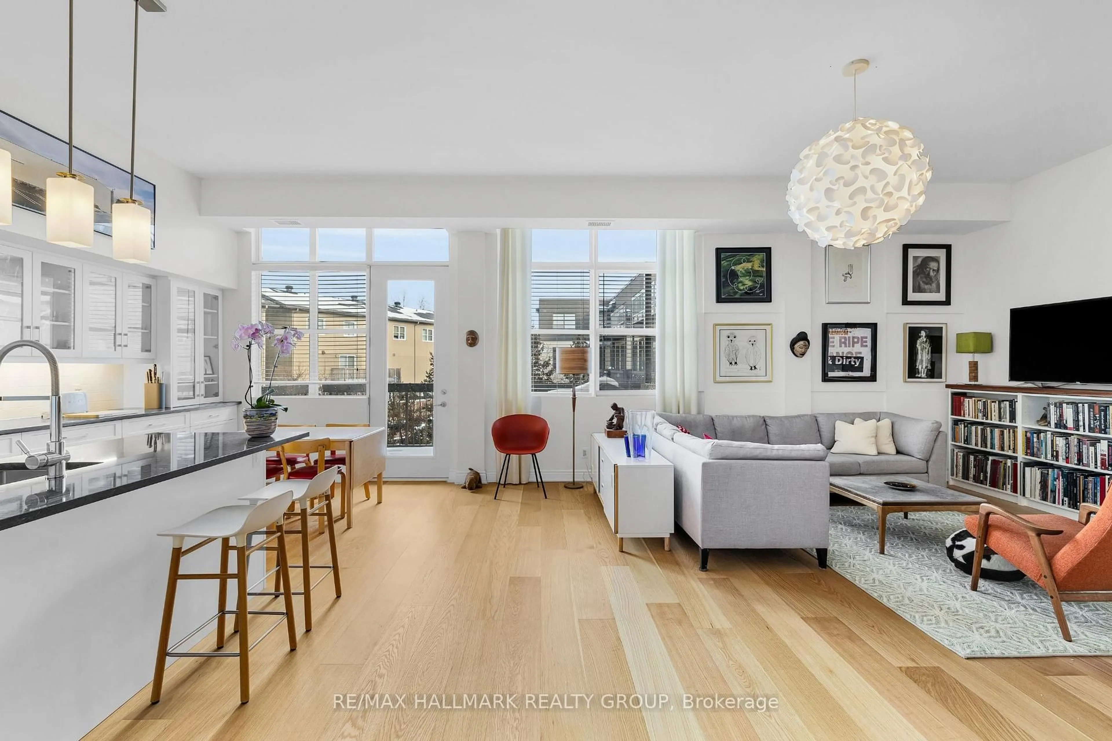 Living room with furniture, floor is not visible for 345 St Denis St #211, Ottawa Ontario K1L 5J1