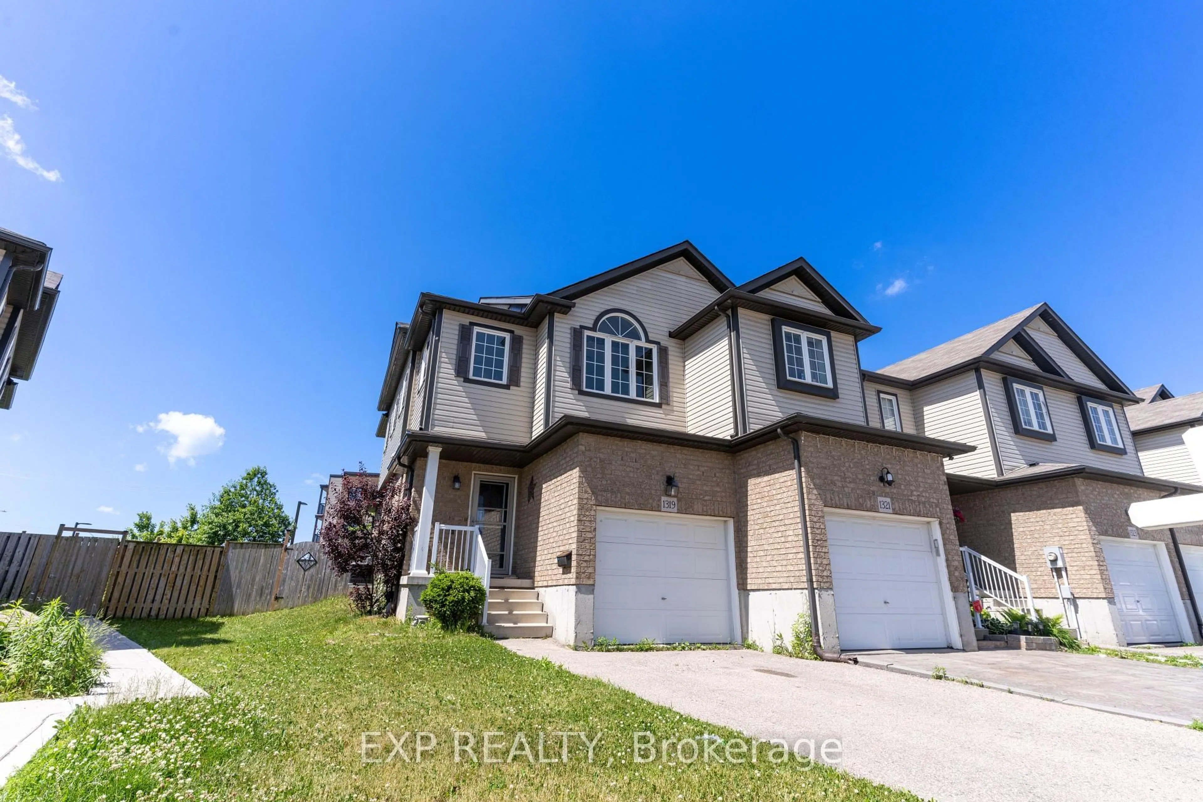 A pic from outside/outdoor area/front of a property/back of a property/a pic from drone, street for 1319 COUNTRYSTONE Dr, Kitchener Ontario N2N 3R9