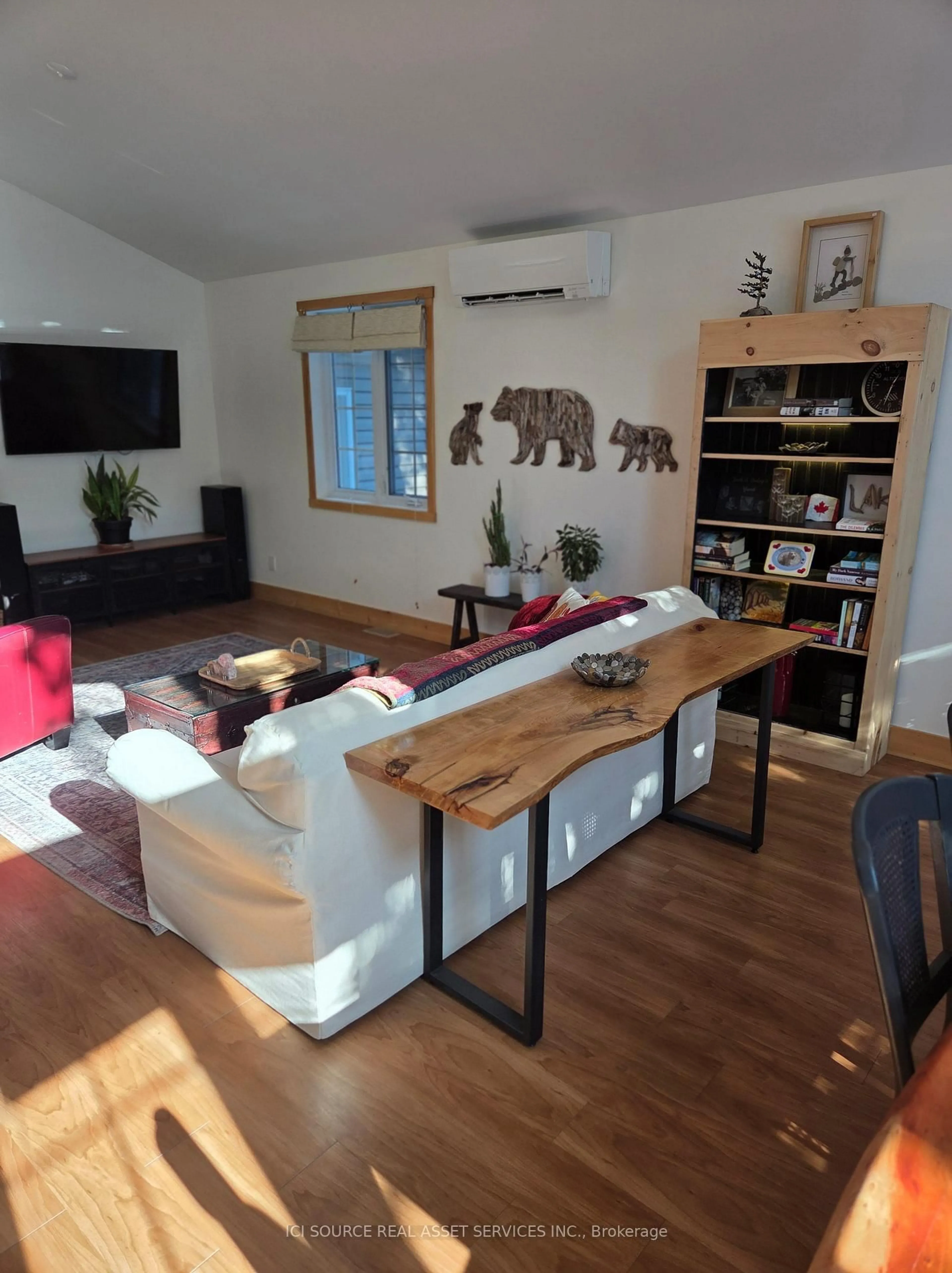 Living room with furniture, wood/laminate floor for 48 Head St, Northern Bruce Peninsula Ontario N0H 2R0