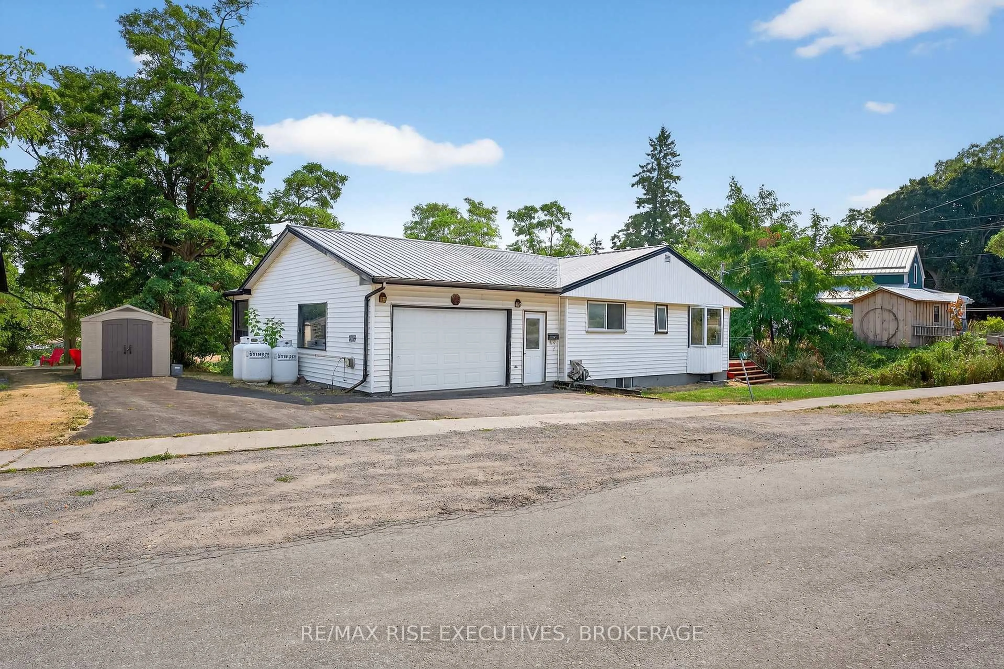 A pic from outside/outdoor area/front of a property/back of a property/a pic from drone, street for 14 Highway 95, Wolfe Island Ontario K0H 2Y0