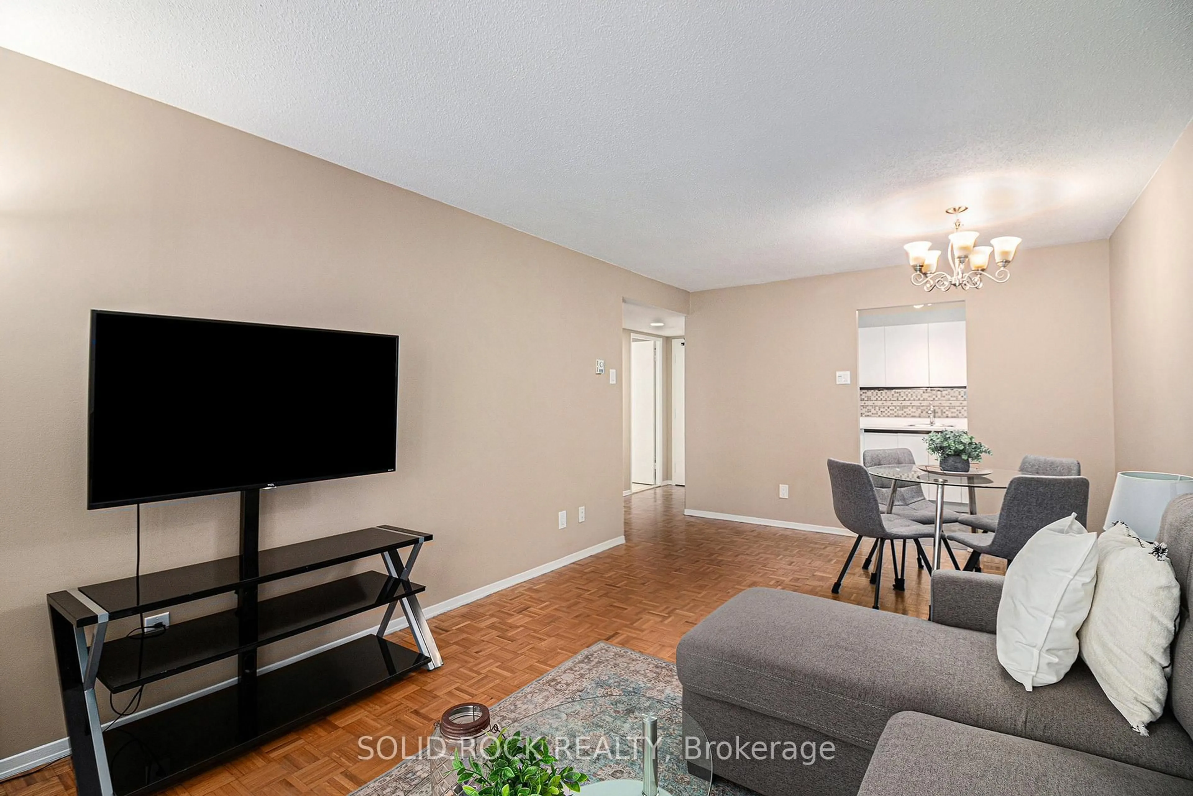 Living room with furniture, wood/laminate floor for 475 Laurier Ave #1204, Ottawa Ontario K1R 7X1