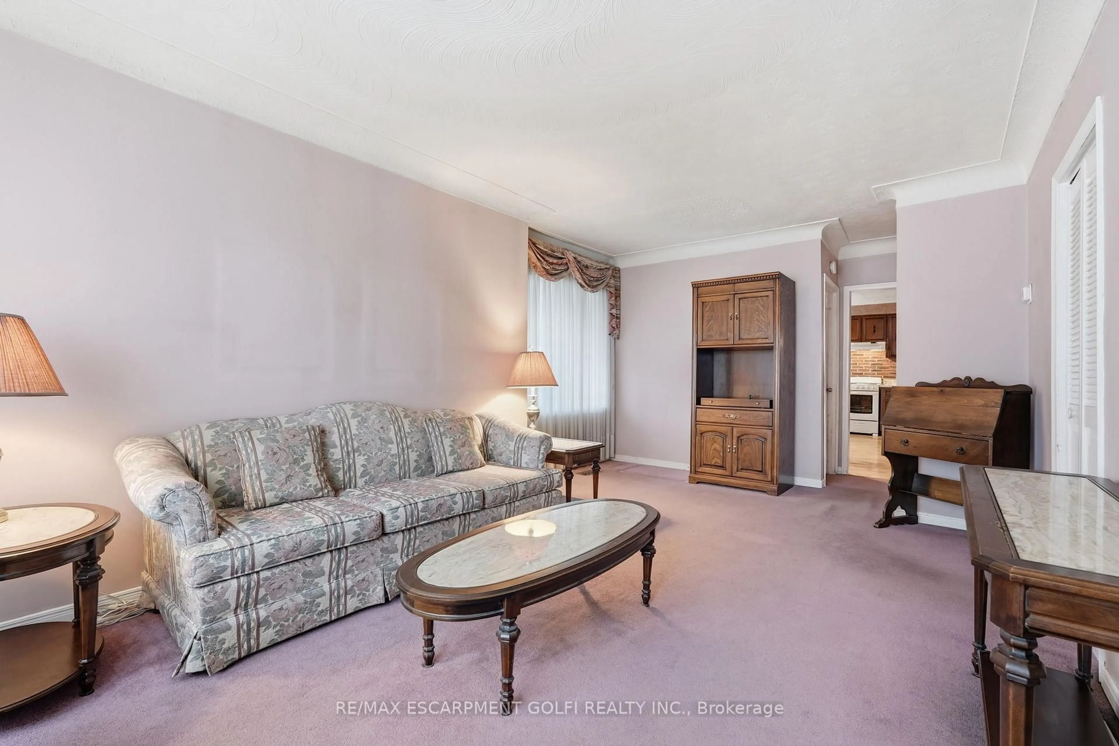 Living room with furniture, carpet floor for 251 Brucedale Ave, Hamilton Ontario L9A 1P5