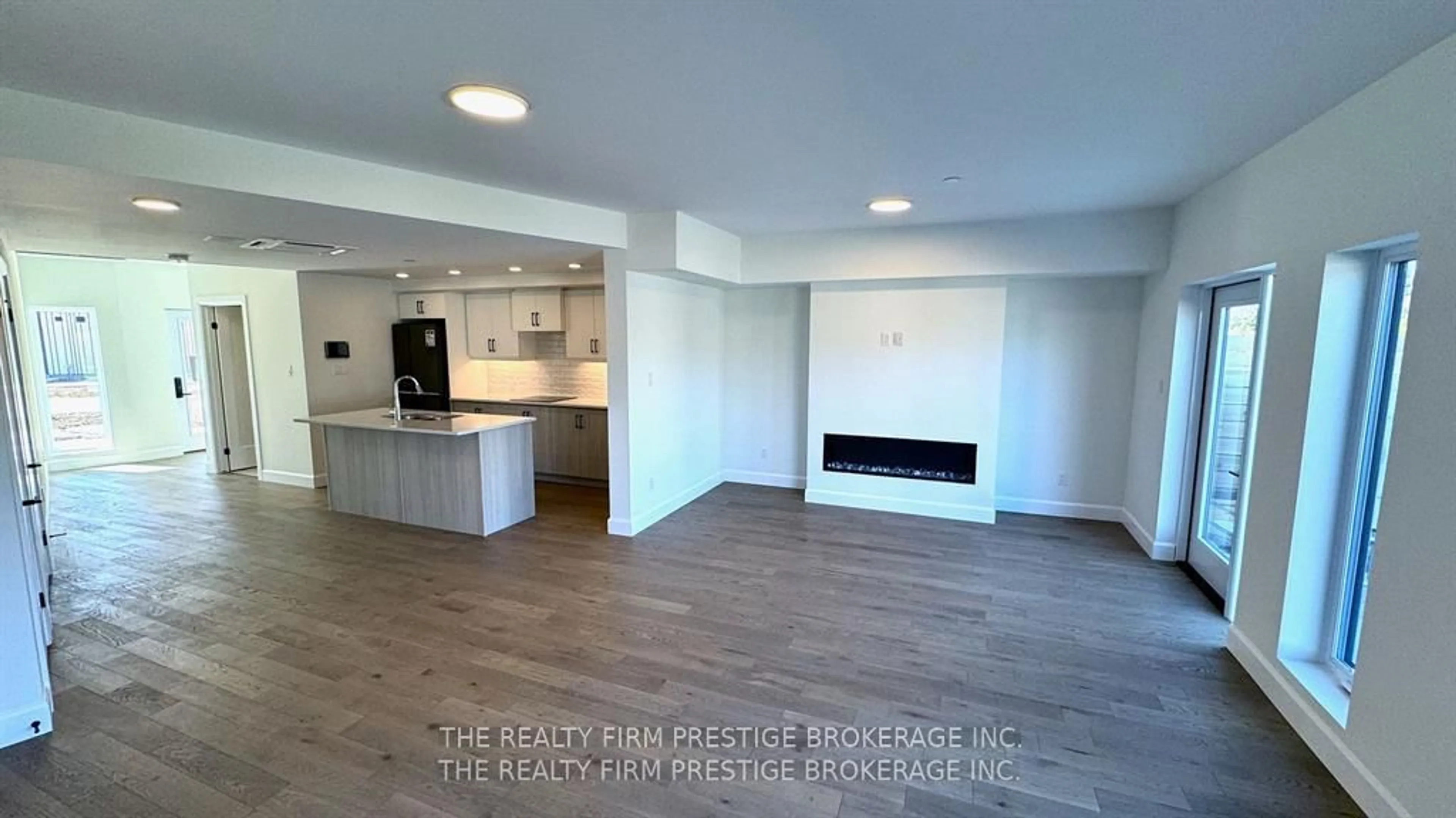Open concept kitchen, wood/laminate floor for 2082 Lumen Dr #B118, London South Ontario N6K 0L3