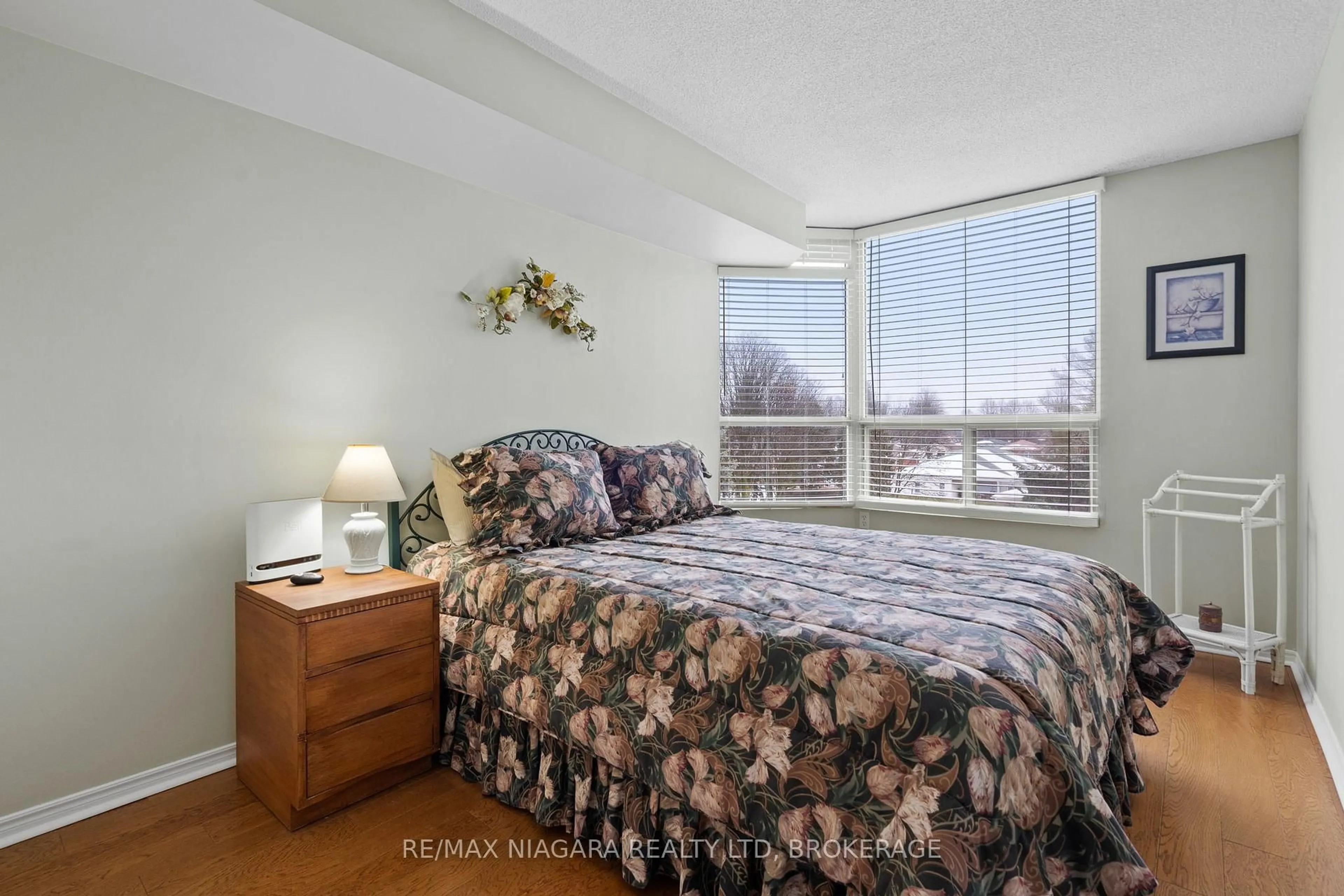 Bedroom with bed, carpet floor for 5100 Dorchester Rd #402, Niagara Falls Ontario L2E 7H4