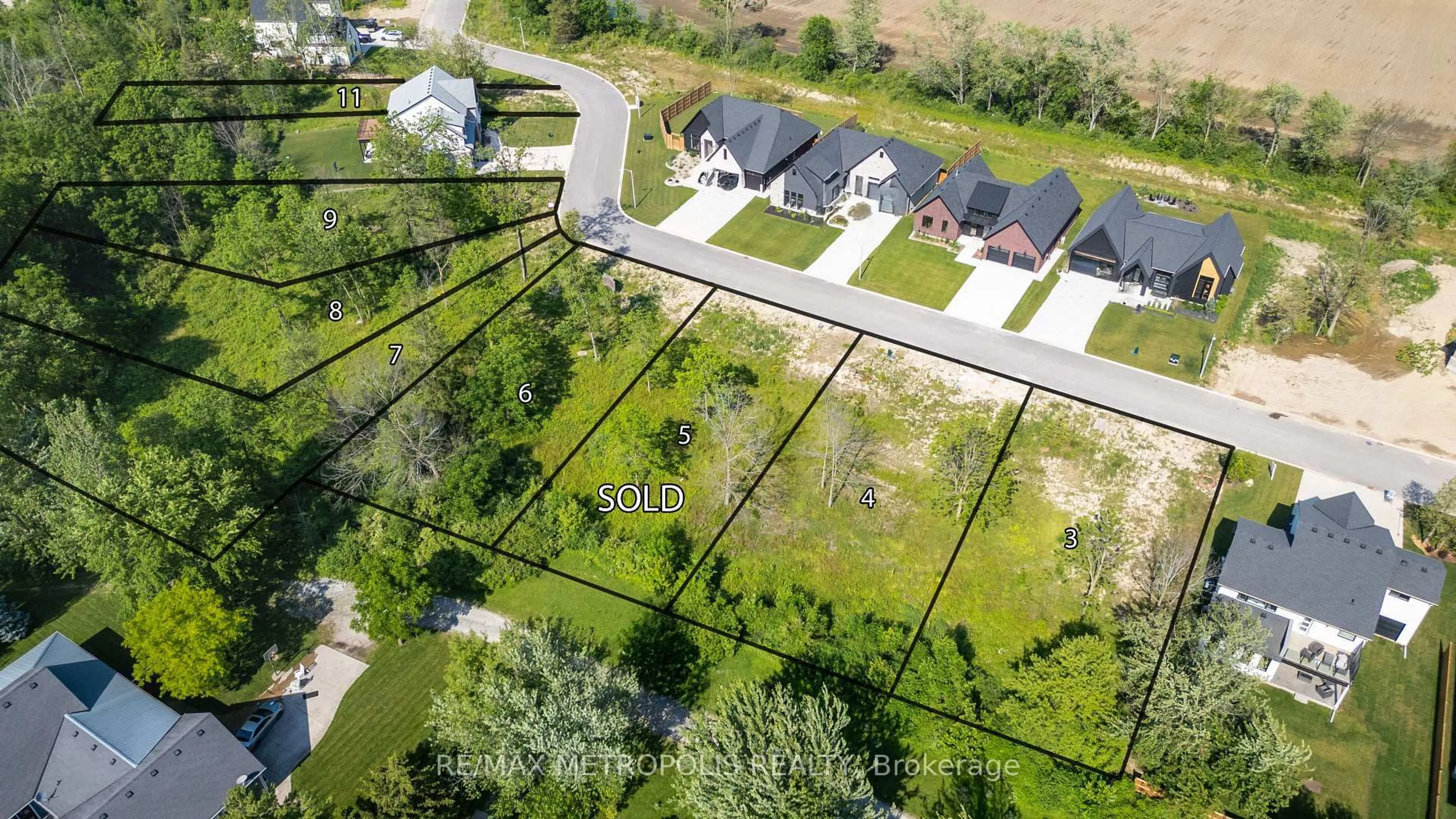 A pic from outside/outdoor area/front of a property/back of a property/a pic from drone, street for 7027 Blue Coast Hts, Plympton-Wyoming Ontario N0N 1E0