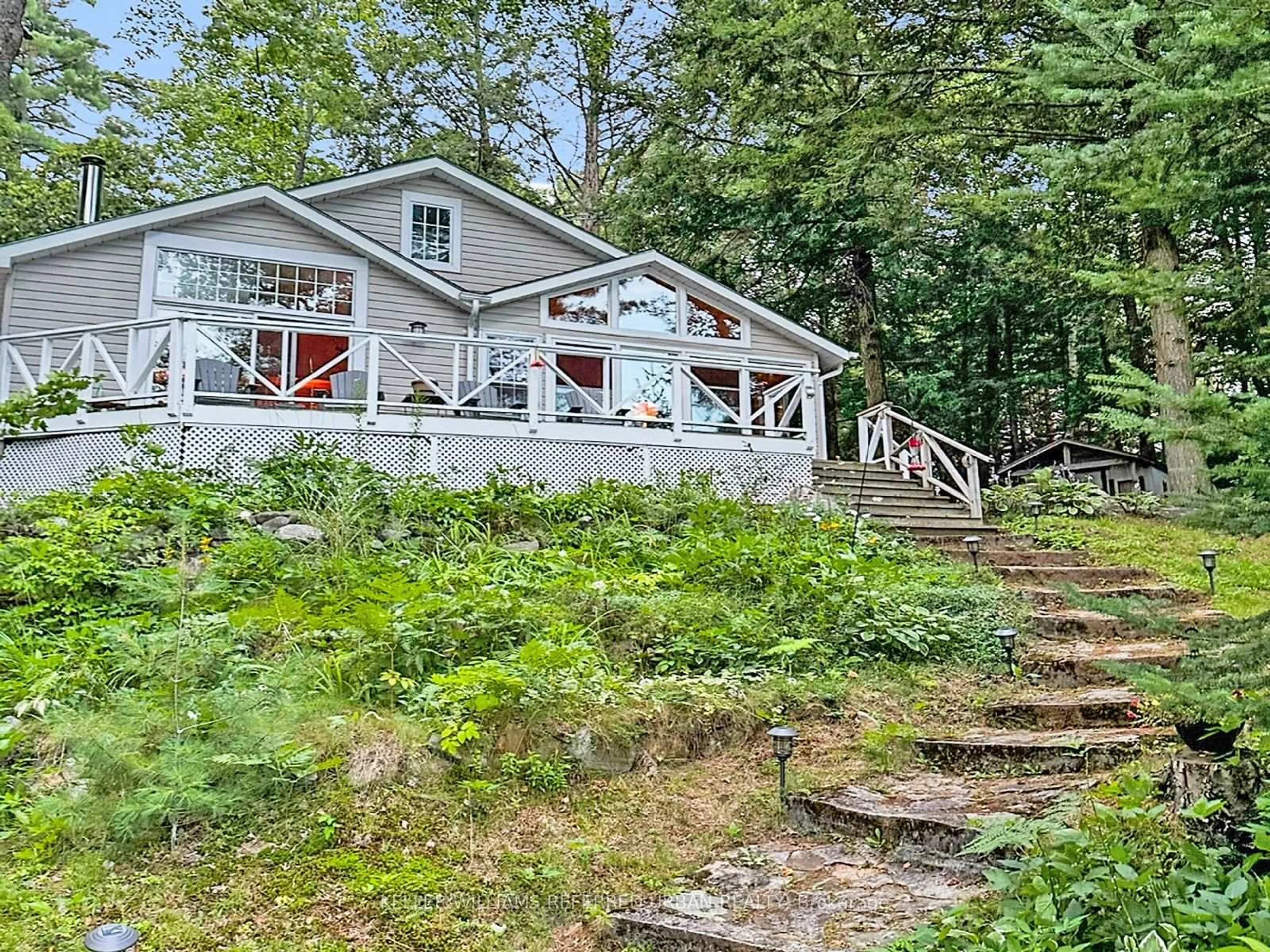 A pic from outside/outdoor area/front of a property/back of a property/a pic from drone, water/lake/river/ocean view for 1118 Pine Lake Shores, Bracebridge Ontario P1L 1X3