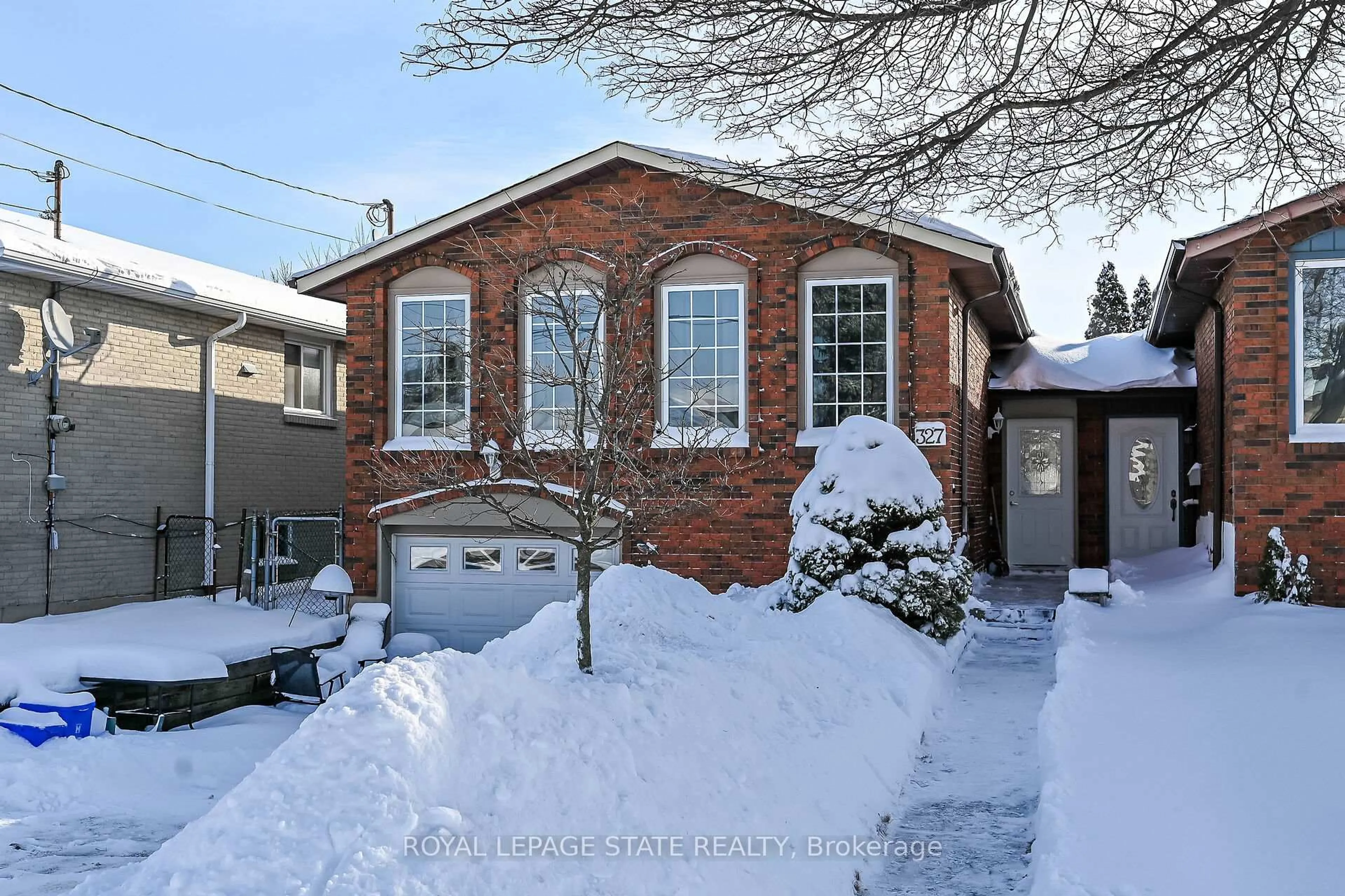 Home with brick exterior material, street for 327 Eaglewood Dr, Hamilton Ontario L8W 1Z2