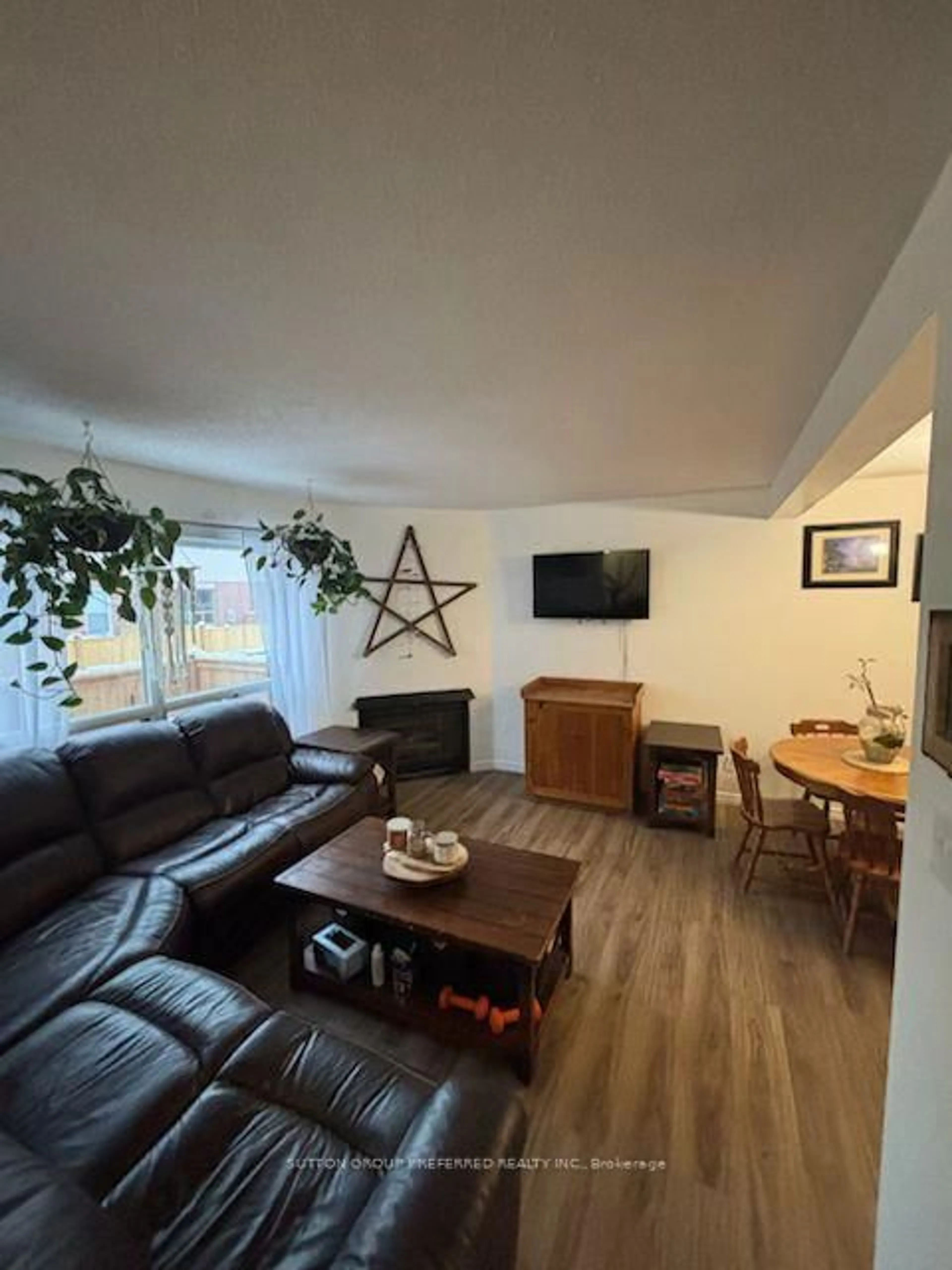 Living room with furniture, wood/laminate floor for 595 Third St #77, London East Ontario N5V 4A1