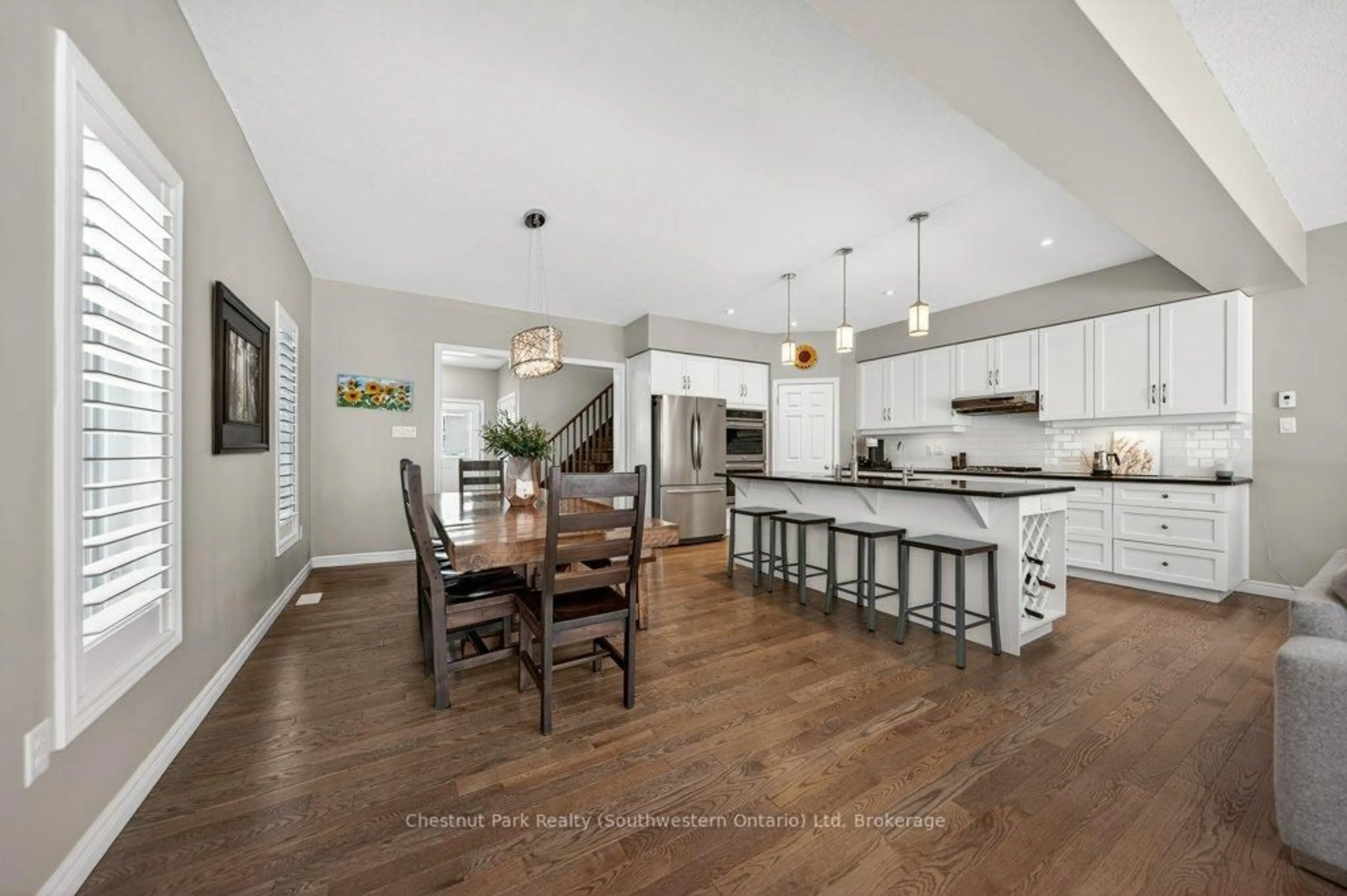 Open concept kitchen, wood/laminate floor for 22 Rooke Crt, Guelph Ontario N1K 0B8