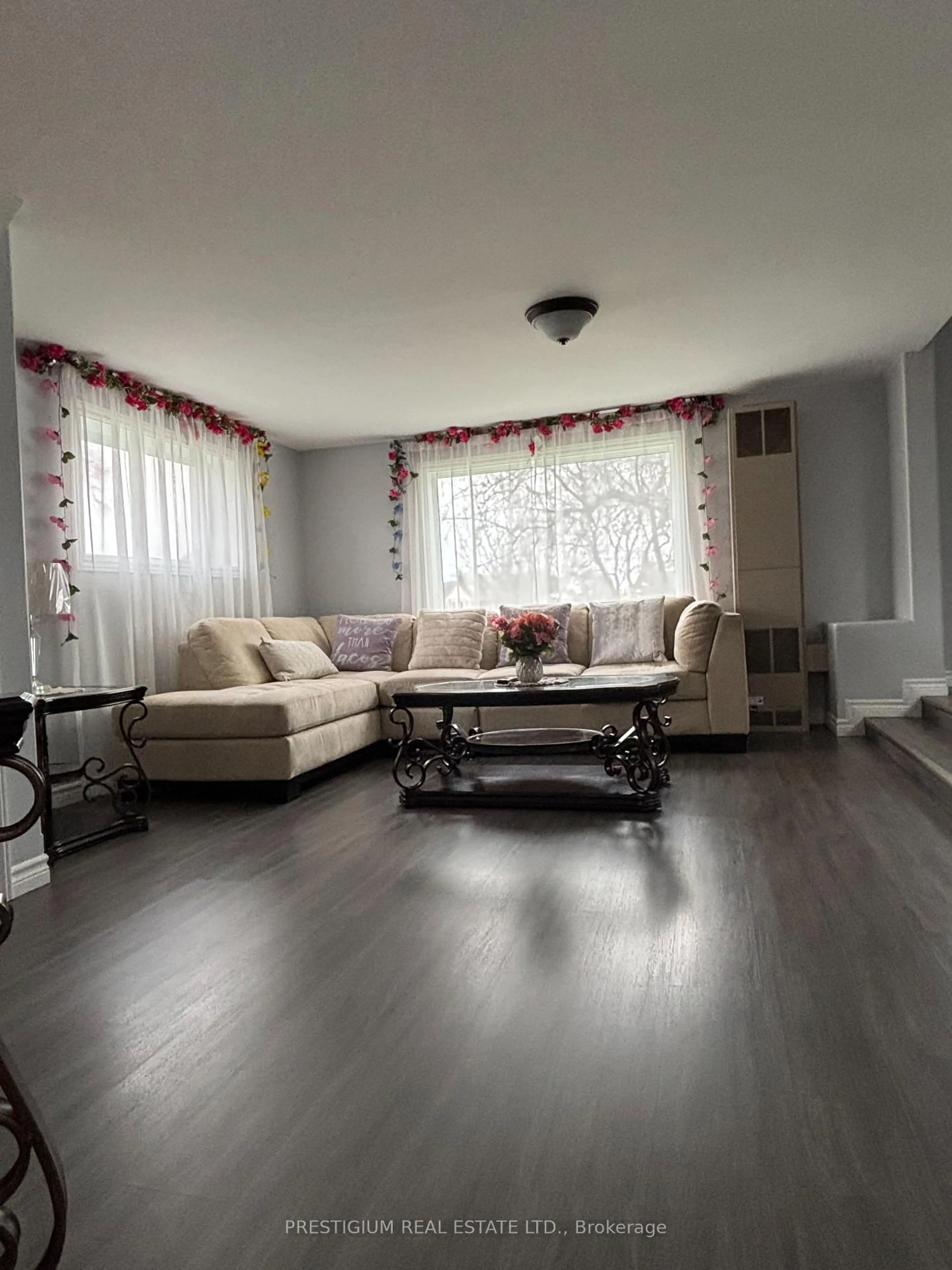 Living room with furniture, wood/laminate floor for 169 East Balfour St, Sault Ste Marie Ontario P6C 1X7